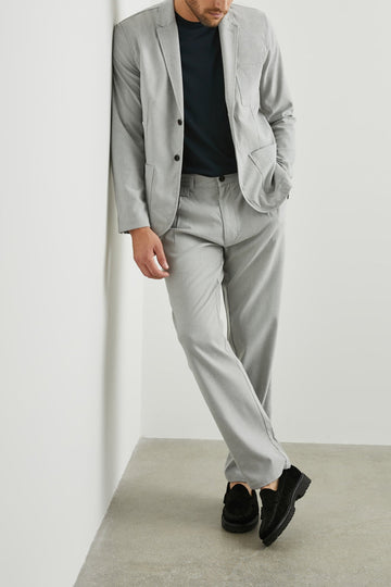 Marcellus Pants with Belt Loops, Two Seam Front Pockets, a Front Buttoned Flap Pocket, a Back Buttoned Welt Pocket and a Back Welt Pocket in Soft Grey Melange Colorway - Front Full Body View Featured on Model 