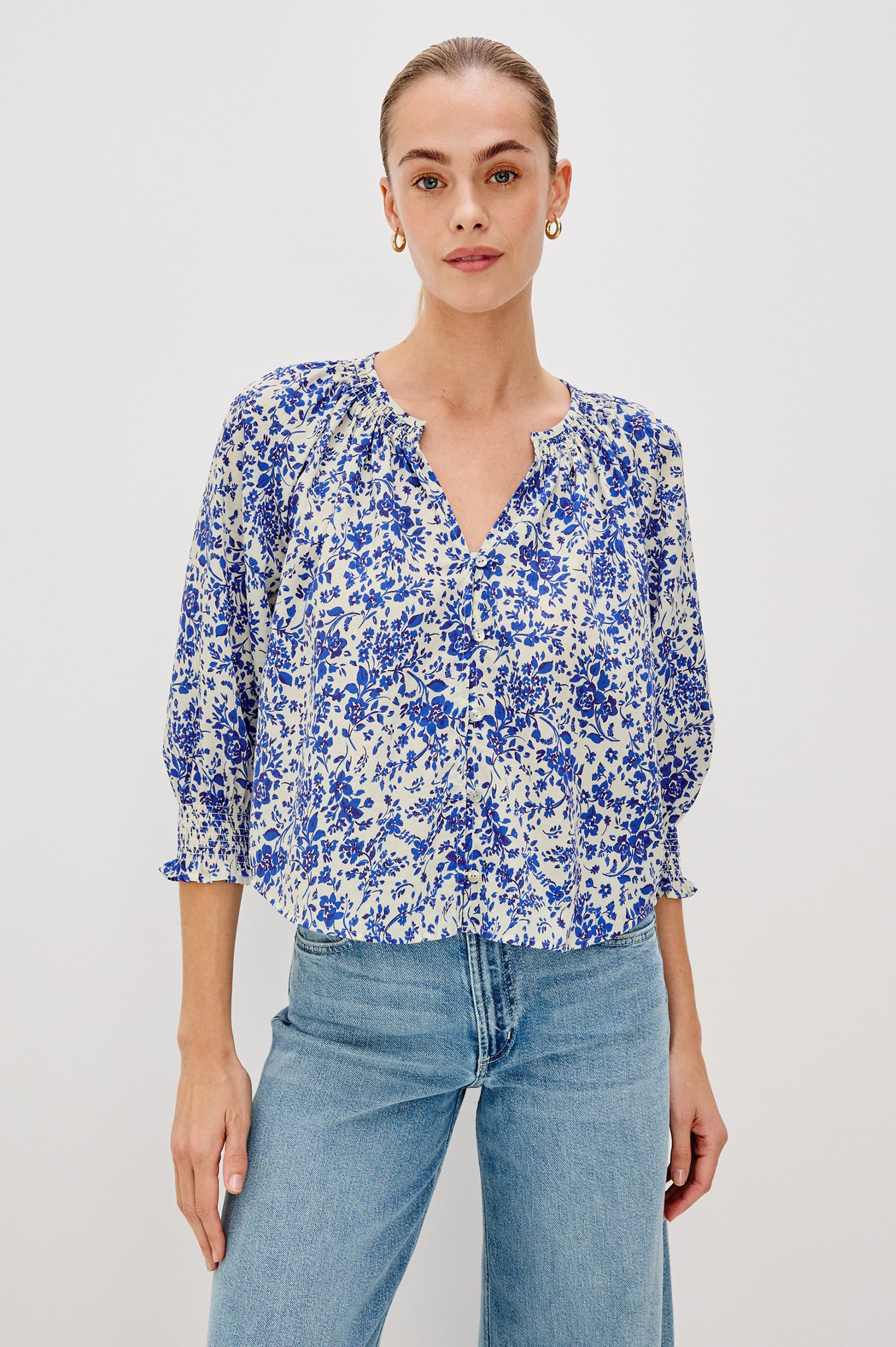 Mariah Button Down Shirt With 3/4" Length Sleeves with Elastic Smoking at Sleeve Hem, V-Neck and Half Button Front in Blue Marguerite Colorway - Front View Featured on Model.