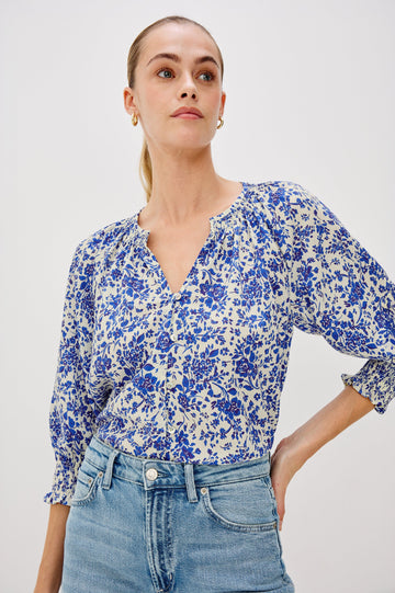Mariah Button Down Shirt With 3/4" Length Sleeves with Elastic Smoking at Sleeve Hem, V-Neck and Half Button Front in Blue Marguerite Colorway - Front View Featured on Model.