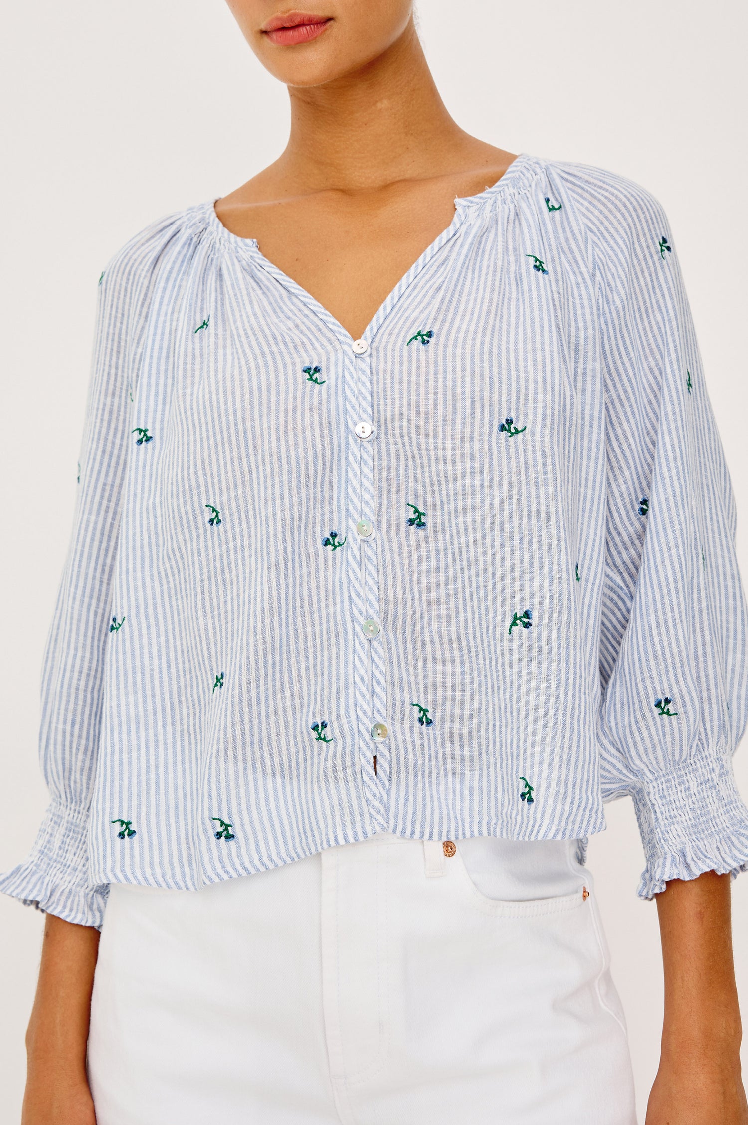 Mariah Peasant Style Bouse Top in Beach Cotton With Split V-Neck Collar, Front Buttons, Smocked Cuffs, and Loose Fit in Bluebell Embroidered Stripe Colorway - Upper Body Front View Featured on Model