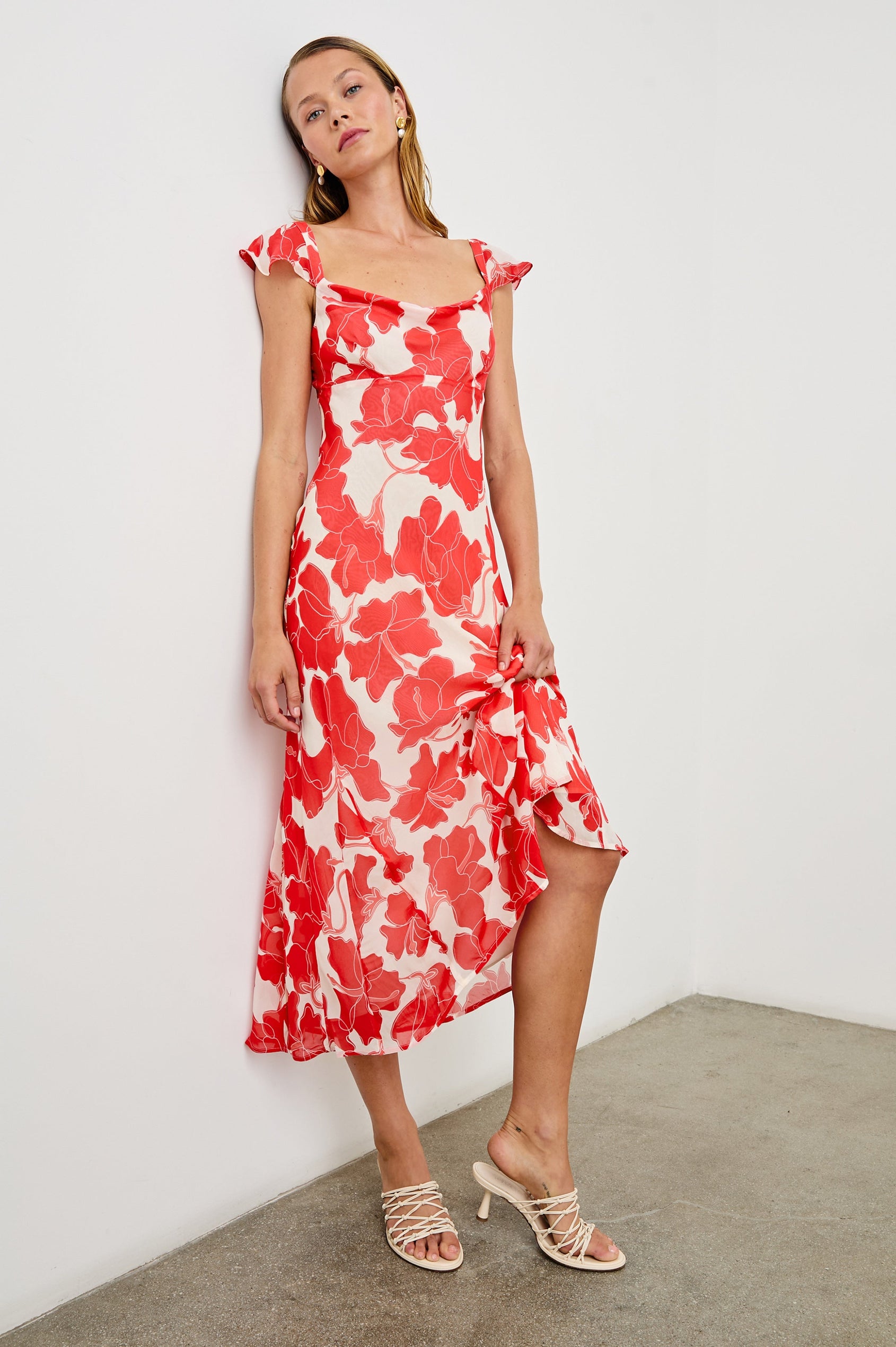 Marigold Midi Dress with Cap Ruffled Sleeves and a Scoop Neckline in Scarlet Hibiscus Colorway on white - Front Full Body View Featured on Model