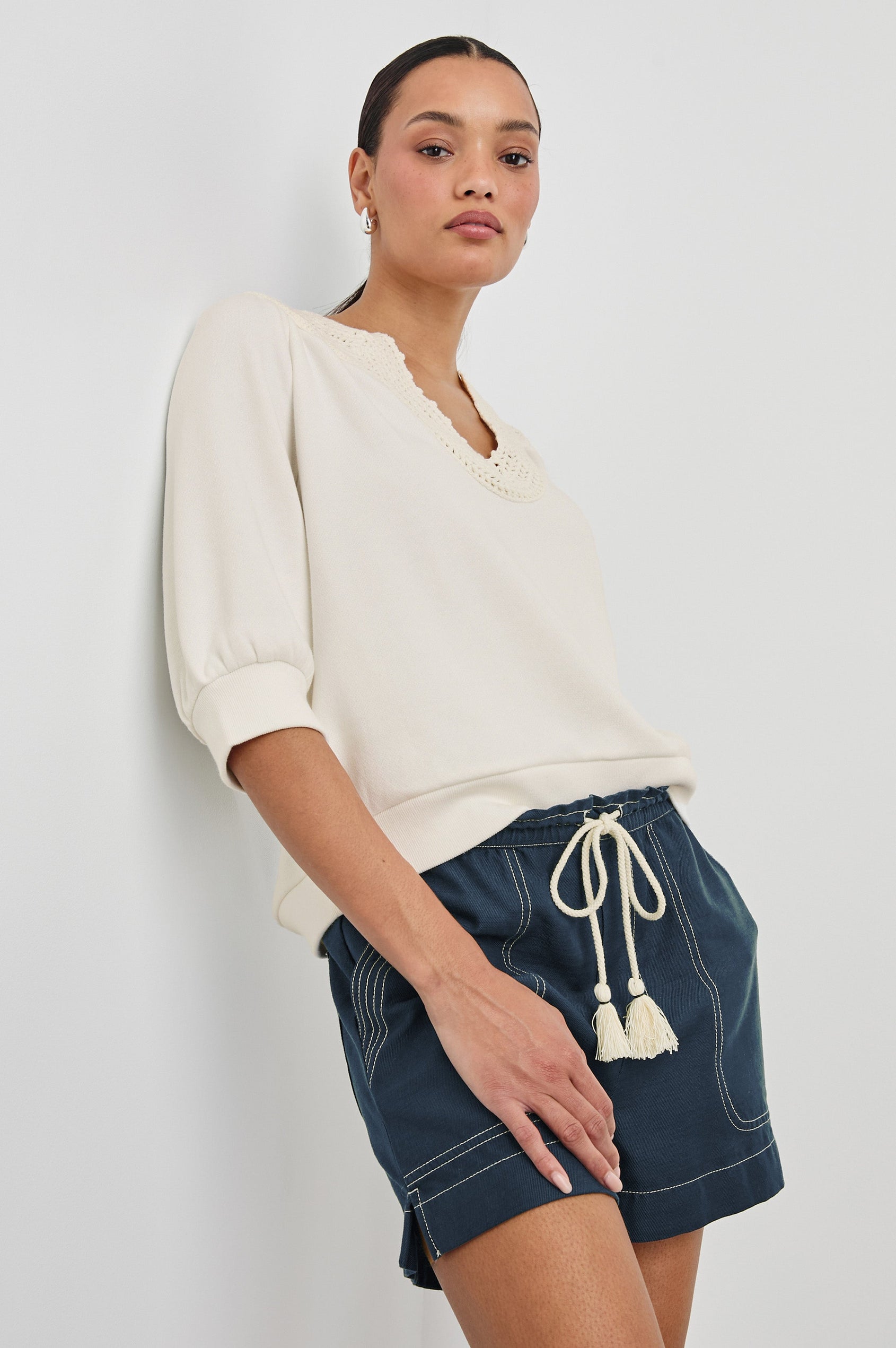 Mariposa Relaxed Fit Top with Elbow Length Sleeves, Tonal Embroidery Details Along Split Neckline in Ivory Colorway.  Front Side View Shown on Model.