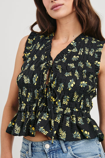 Martine peplum tank top with adjustable front closure ties in Dark Amaryllis - close up of details on model