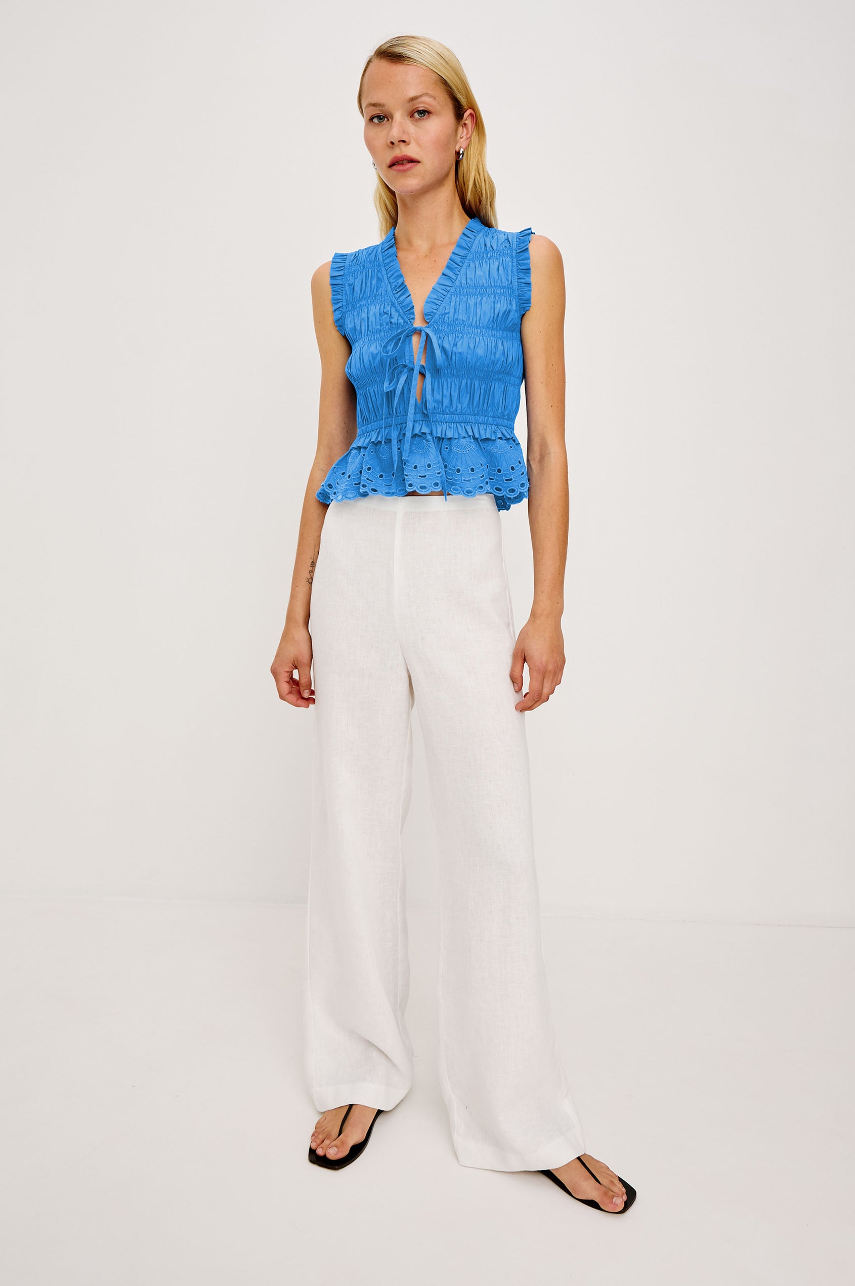 Martine Cropped Sleeveless Top in Heavy Cotton Poplin With Plunging V-Neckline With Adjustable Ties and Ruffle Trim in Harbor Blue Colorway - Full Body Front View Featured on Model