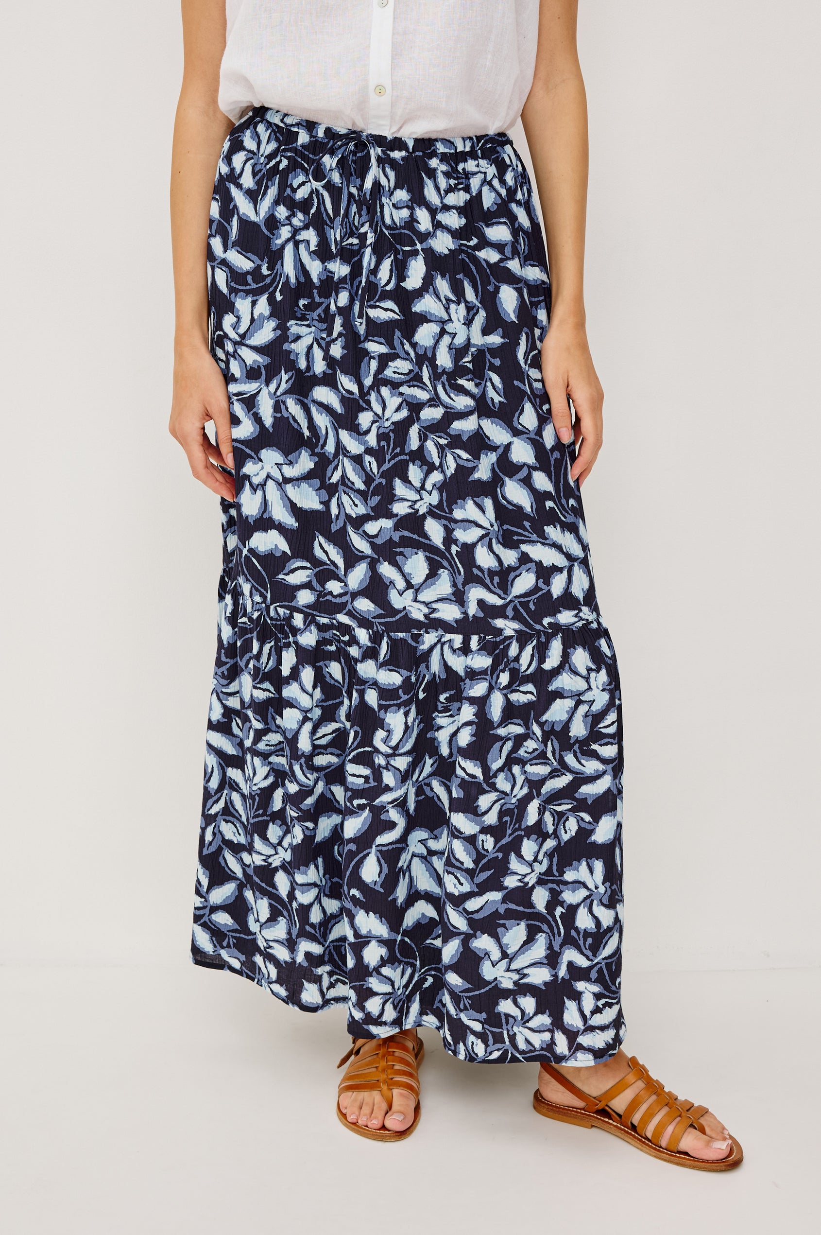 Marulo High-Waisted Floral Maxi Skirt in Pleated Chiffon With Adjustable Drawstring Ties, Single Tier Seam, and Full Interior Lining in Navy Jasmine Colorway - Lower Body Front VIew Featured on Model