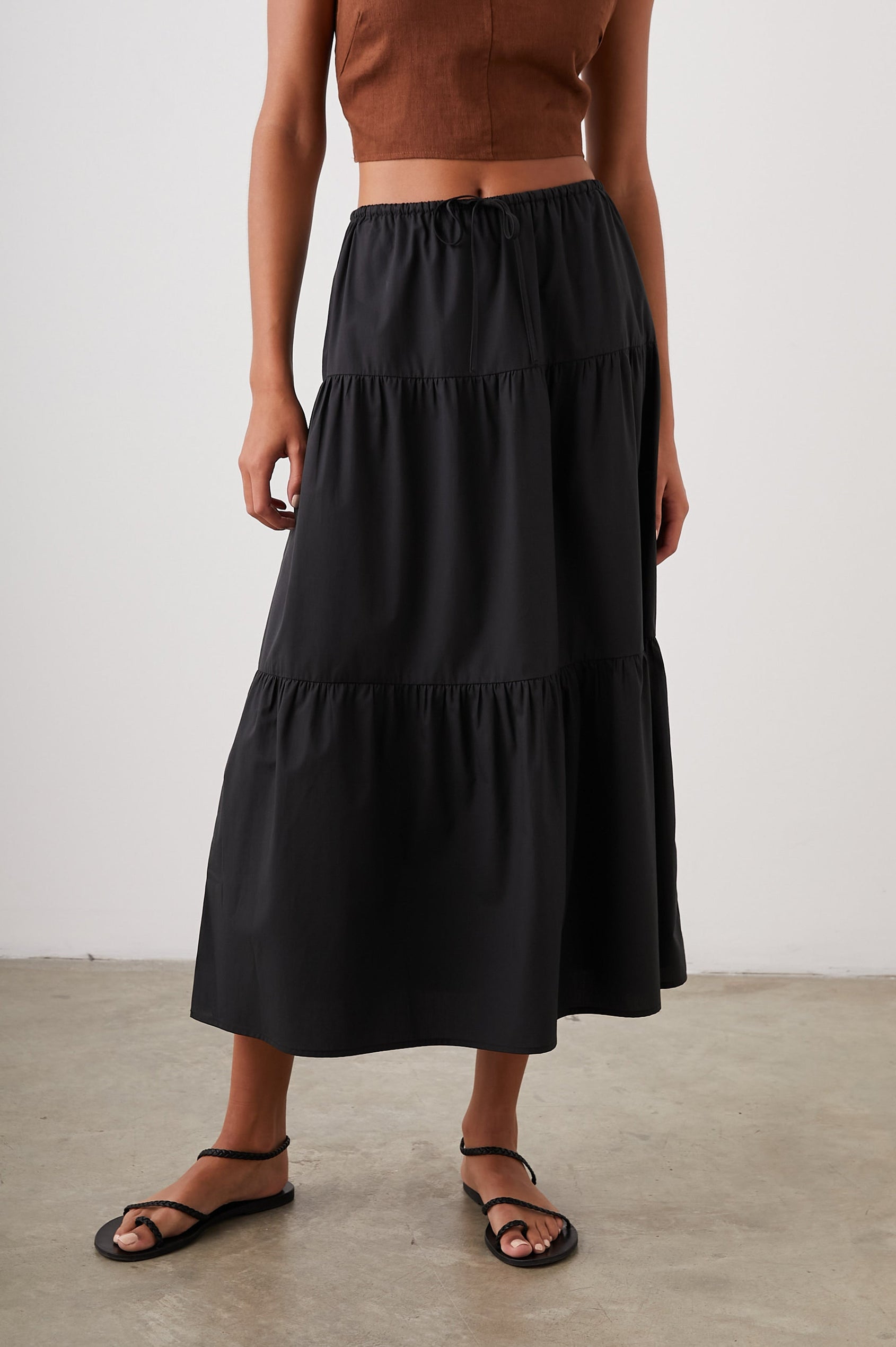 Mary Tiered Midi Skirt with a Drawstring Waist in Black Colorway - Front View Featured on Model