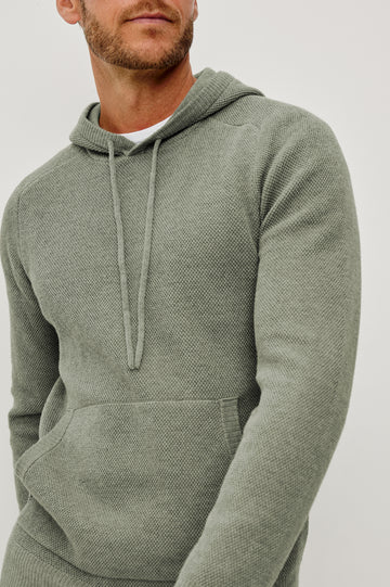 Matador Hoodie Sweatshirt in Cotton Blend With Drawstring TIes, Front Kangaroo Pockets, and Long Sleeves in Sage Heather - Upper Body Close Up Front View Featured on Model