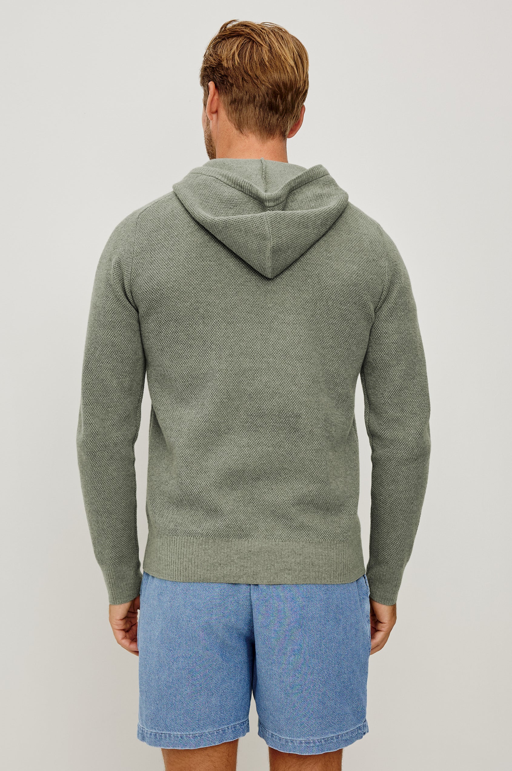 Matador Hoodie Sweatshirt in Cotton Blend With Drawstring TIes, Front Kangaroo Pockets, and Long Sleeves in Sage Heather - Upper Body Back View Featured on Model