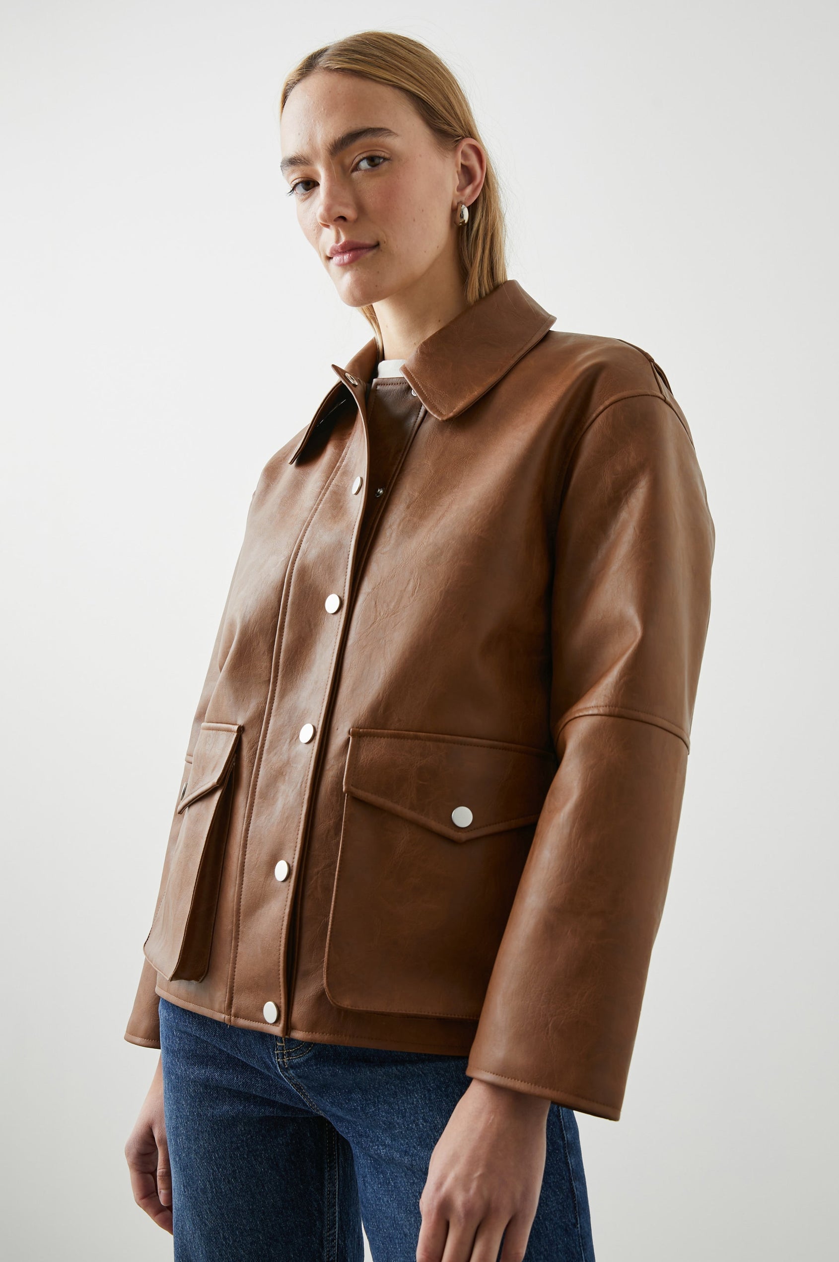 Mathis Faux Leather Jacket with Snap Closure and Two Front Snap Flap Pockets in Russet Colorway - Front View Featured on Model  