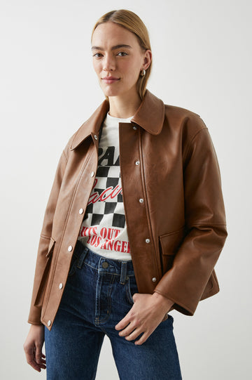 Mathis Faux Leather Jacket with Snap Closure and Two Front Snap Flap Pockets in Russet Colorway - Front View Featured on Model  
