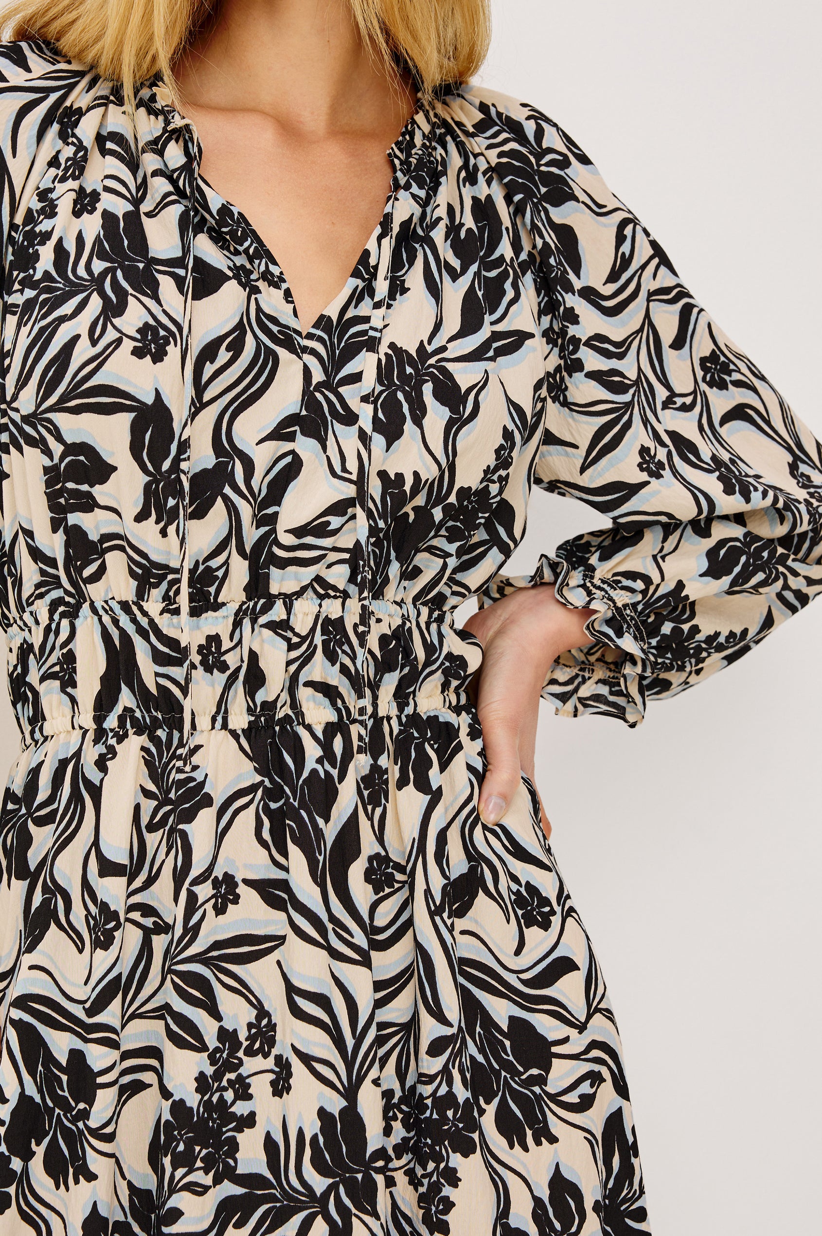 Matia Maxi Dress in Cotton With Banded Ruffle V-Neckline With Self-Ties, Elastic Waist, and Long Raglan Puff Sleeves in Zinya Colorway - Upper Body Front View Featured on Model