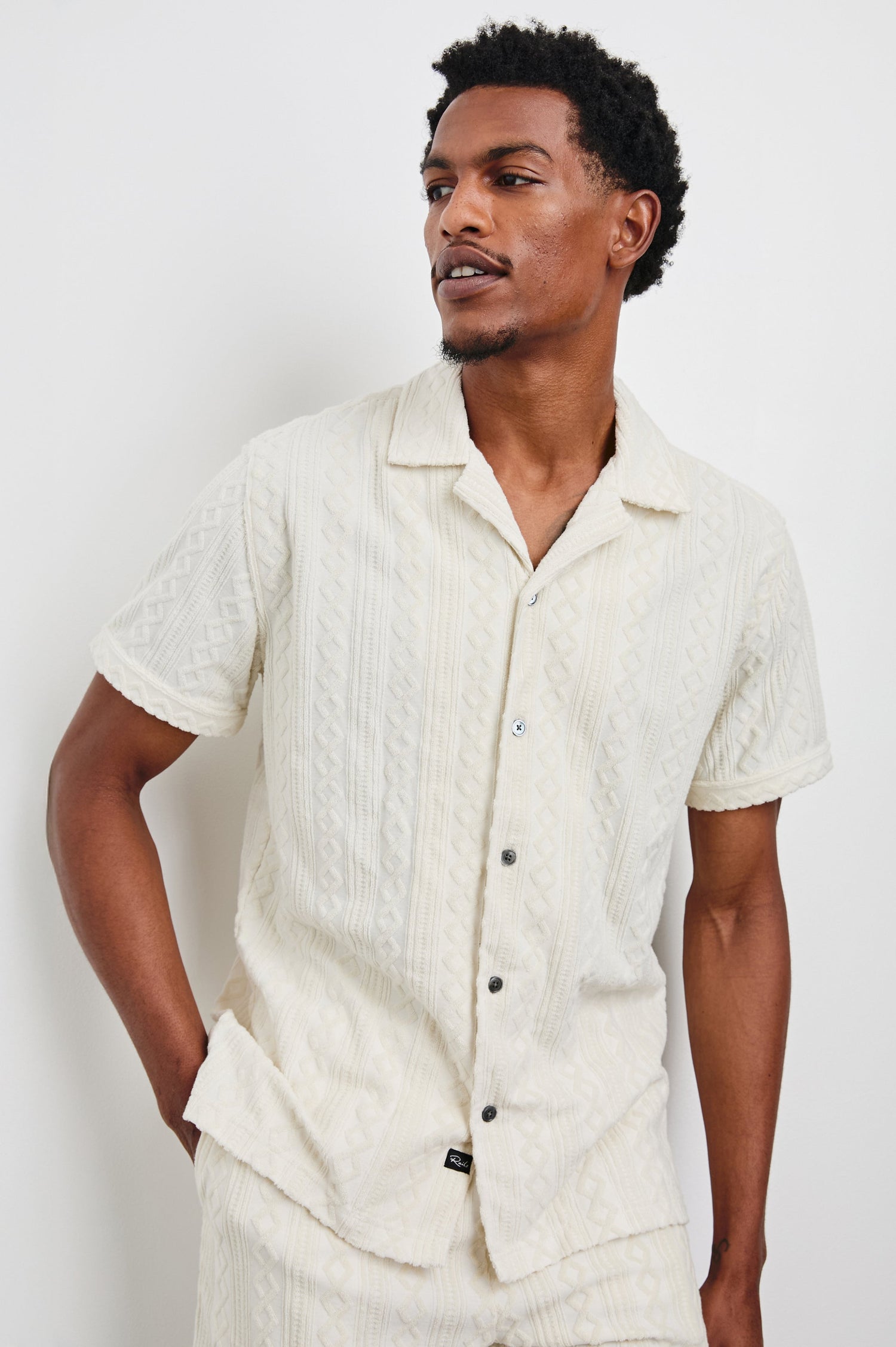 Maverick Short Sleeve Button Up with a raised jacquard pattern in Ecru Colorway - Front View Featured on Model