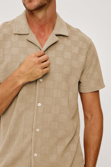 Maverick Short Sleeve Shirt in French Terry With Jacquard Pattern, Notched Collar, Front Buttons, and Classic Fit in Grange Craft Paper Colorway - Upper Body Close Up Front View Featured on Model