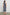 Max Wrap Dress with a Scoop Neck, Sleeveless, Gathering at Side Seam and Front Slit in Navy and White Nautical Stripe Colorway. Back View Shown on Model.