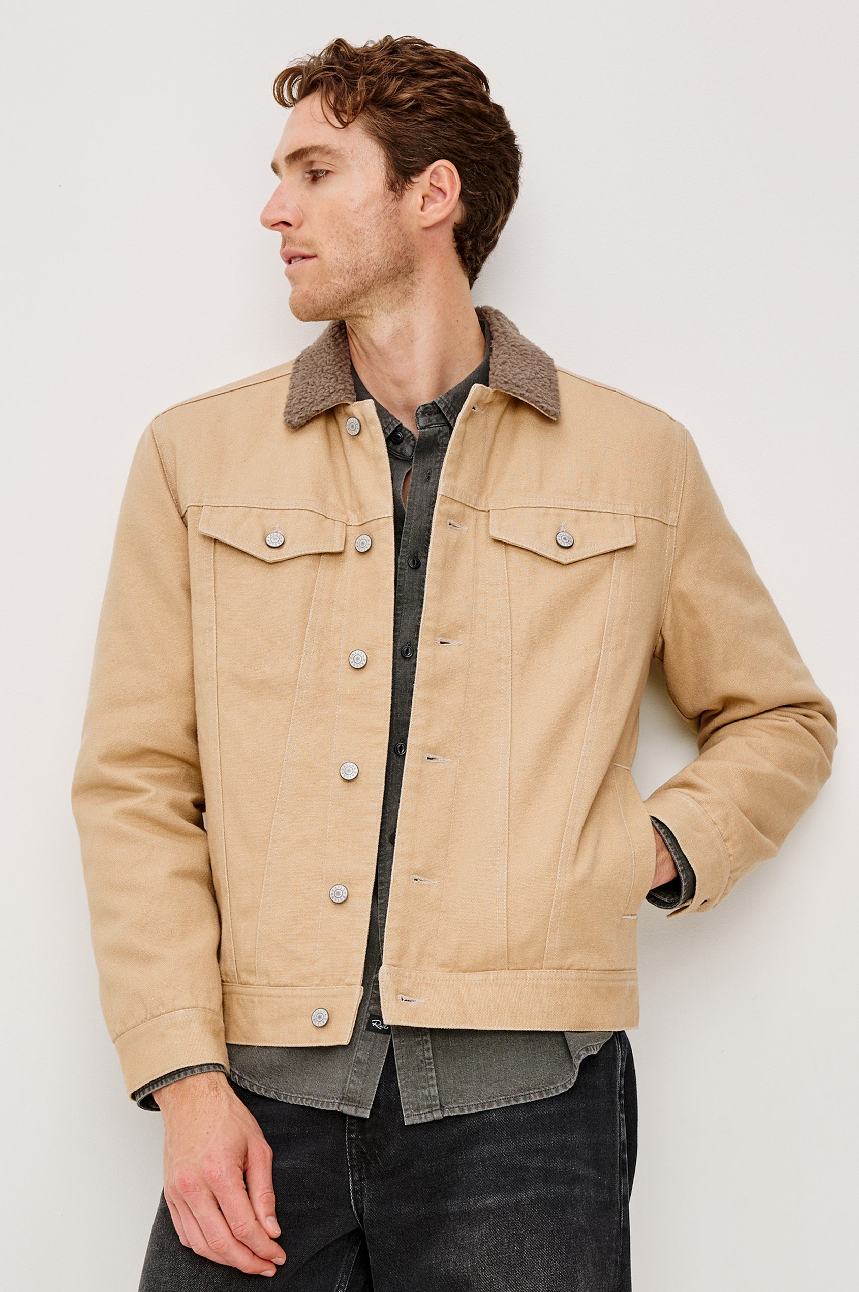 McKinley Jacket with Button Closure, Two Chest Button Flap Pockets and a Brown Contrast Collar in Duck Colorway. Front View Featured on Model.