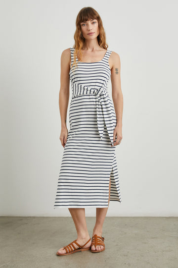Meg Sleeveless Midi Dress with Shoulder Straps, a Square Neck, a Side Slit, and a Fabric Waist Tie in Ivory Navy Stripe Colorway, Horizontal Stripes - Front Full Body View Featured on Model 