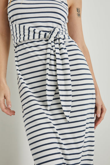 Meg Sleeveless Midi Dress with Shoulder Straps, a Square Neck, a Side Slit, and a Fabric Waist Tie in Ivory Navy Stripe Colorway, Horizontal Stripes - Front View Featured on Model 