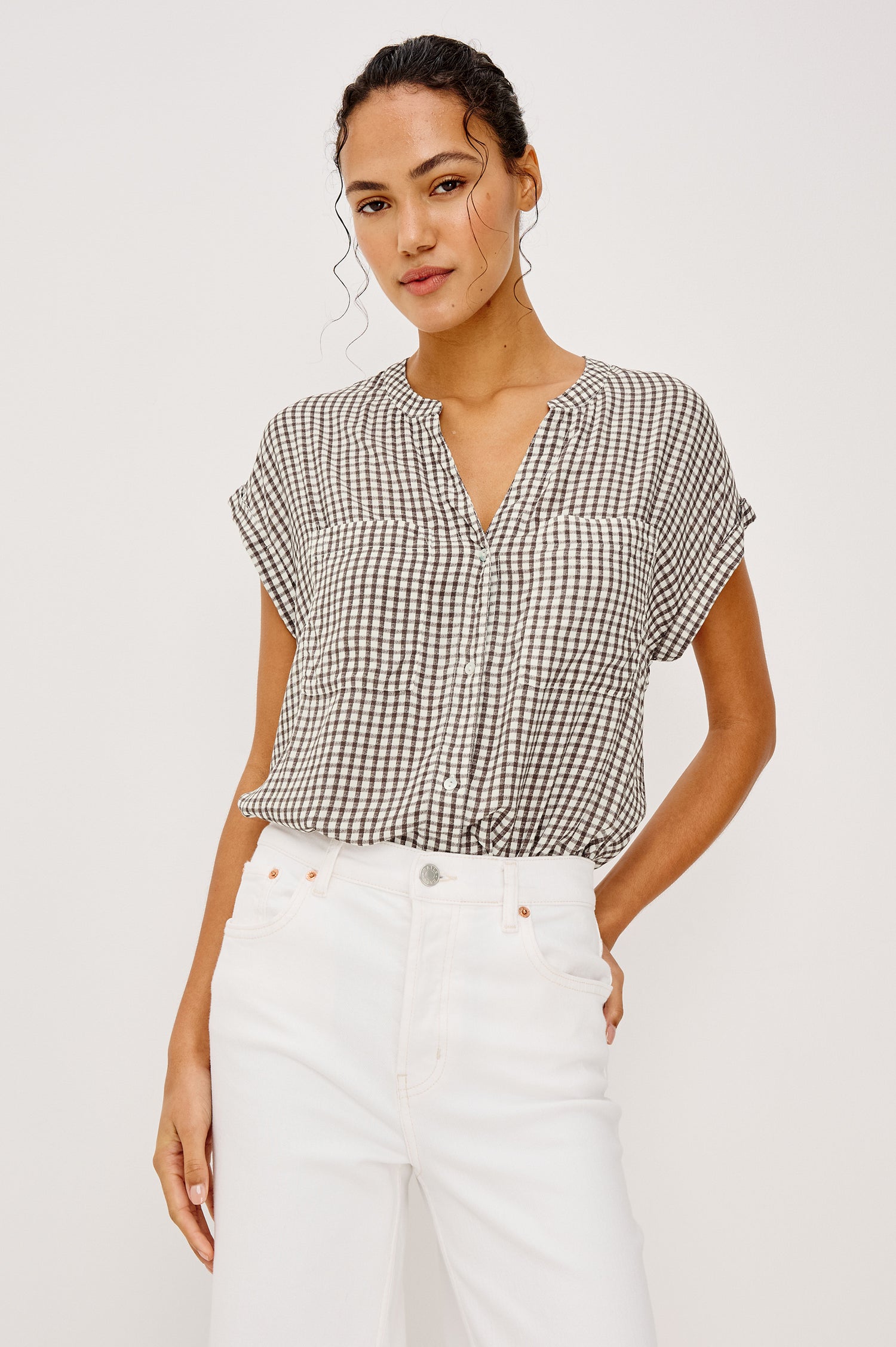 Mel Boxy Button-Up Shirt With Ruffled Cap Sleeves Banded V-Neckline Front Buttons Chest Patch Pockets and Curved High Neckline in Espresso Gingham - Upper Body Front View Featured on Model