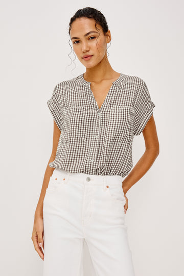 Mel Boxy Button-Up Shirt With Ruffled Cap Sleeves Banded V-Neckline Front Buttons Chest Patch Pockets and Curved High Neckline in Espresso Gingham - Upper Body Front View Featured on Model