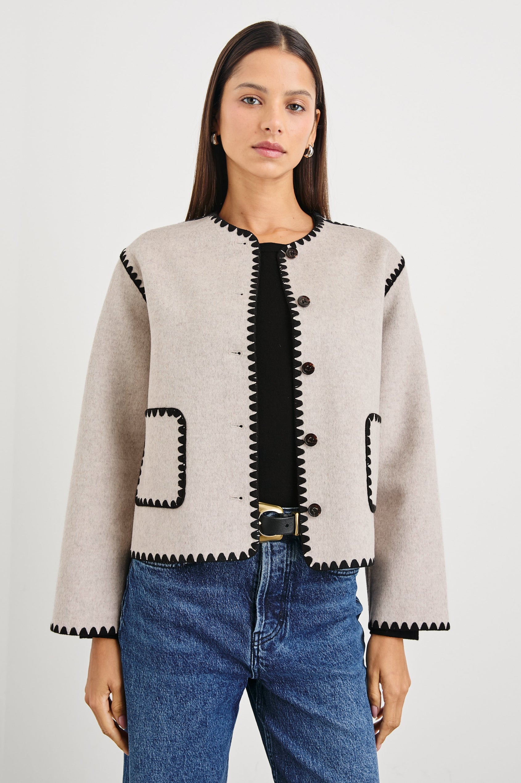 Melanie Jacket with Button Closure and Two Front Patch Pockets in Oatmeal Colorway, with Black Stitching along the Trim and Pockets - Front View Featured on Model
