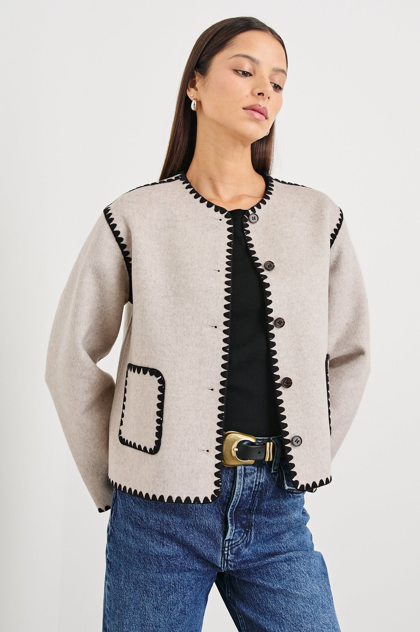 Melanie Jacket with Button Closure and Two Front Patch Pockets in Oatmeal Colorway, with Black Stitching along the Trim and Pockets - Front View Featured on Model