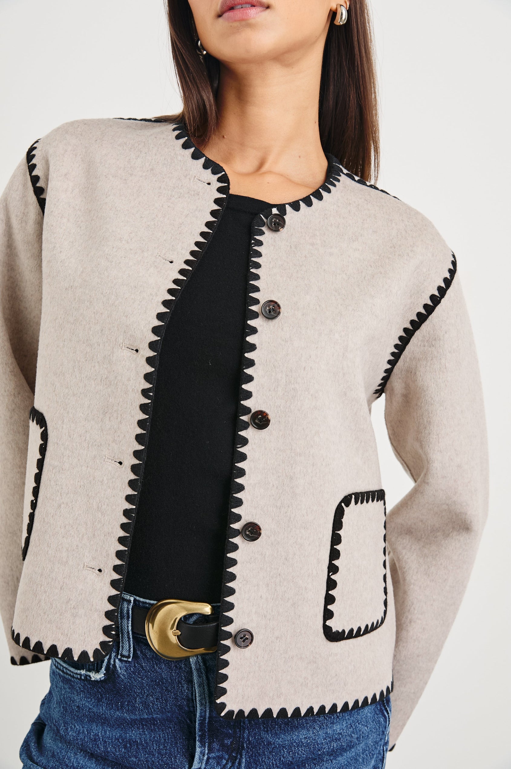 Melanie Jacket with Button Closure and Two Front Patch Pockets in Oatmeal Colorway, with Black Stitching along the Trim and Pockets - Front View Featured on Model