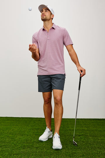 Merced Golf Polo in TENCEL™ Poly Blend With Collar, Quarter Placket, Short Sleeves, and Classic Fit in Hibiscus Mirage Stripe Colorway - Full Body Front View Featured on Model