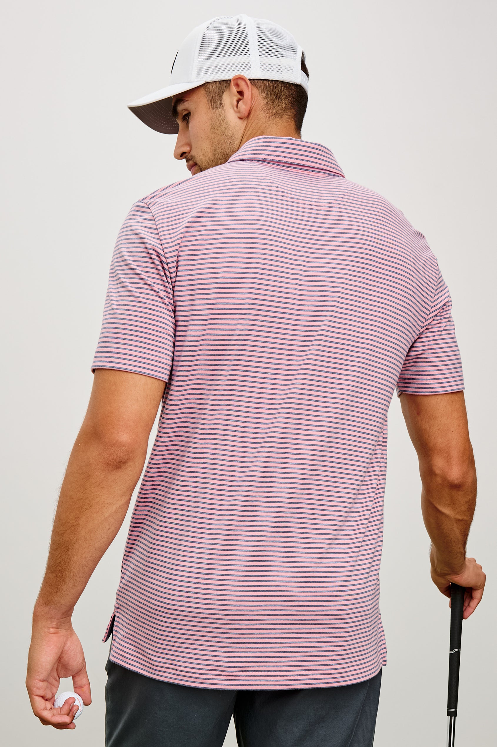 Merced Golf Polo in TENCEL™ Poly Blend With Collar, Quarter Placket, Short Sleeves, and Classic Fit in Hibiscus Mirage Stripe Colorway - Upper Body Back View Featured on Model