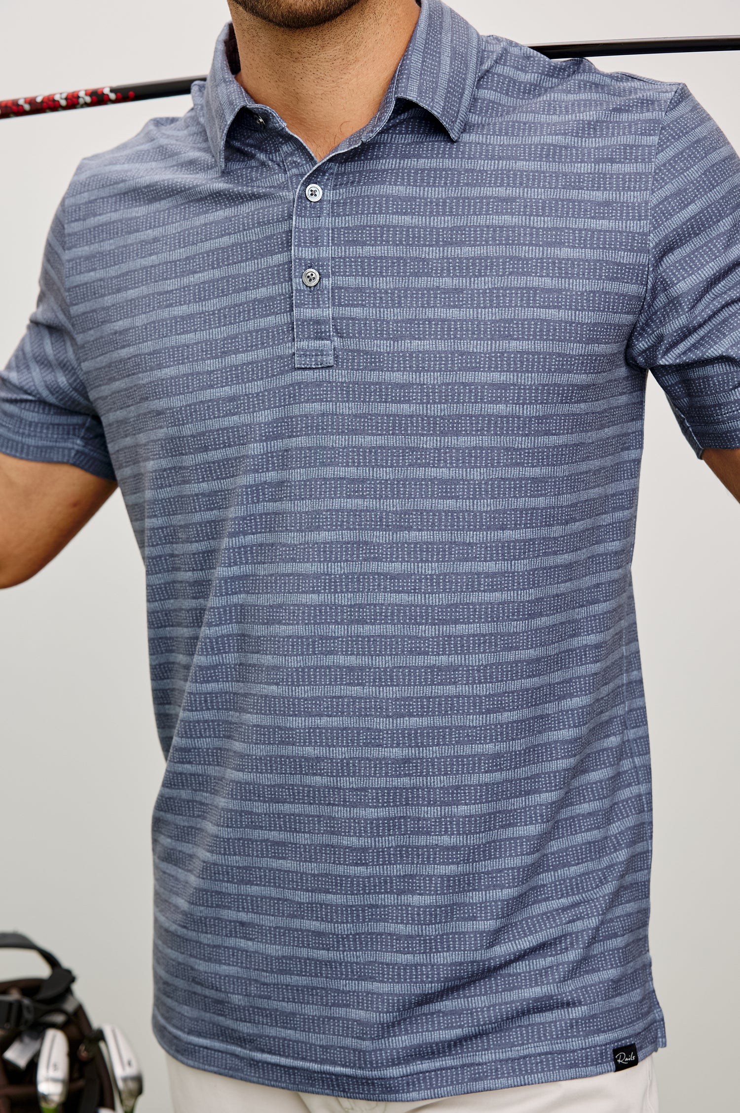 Merced Golf Polo in TENCEL™ Poly Blend With Collar, Quarter Placket, Short Sleeves, and Classic Fit in Hibiscus Mirage Stripe Colorway - Upper Body Front View Featured on Model