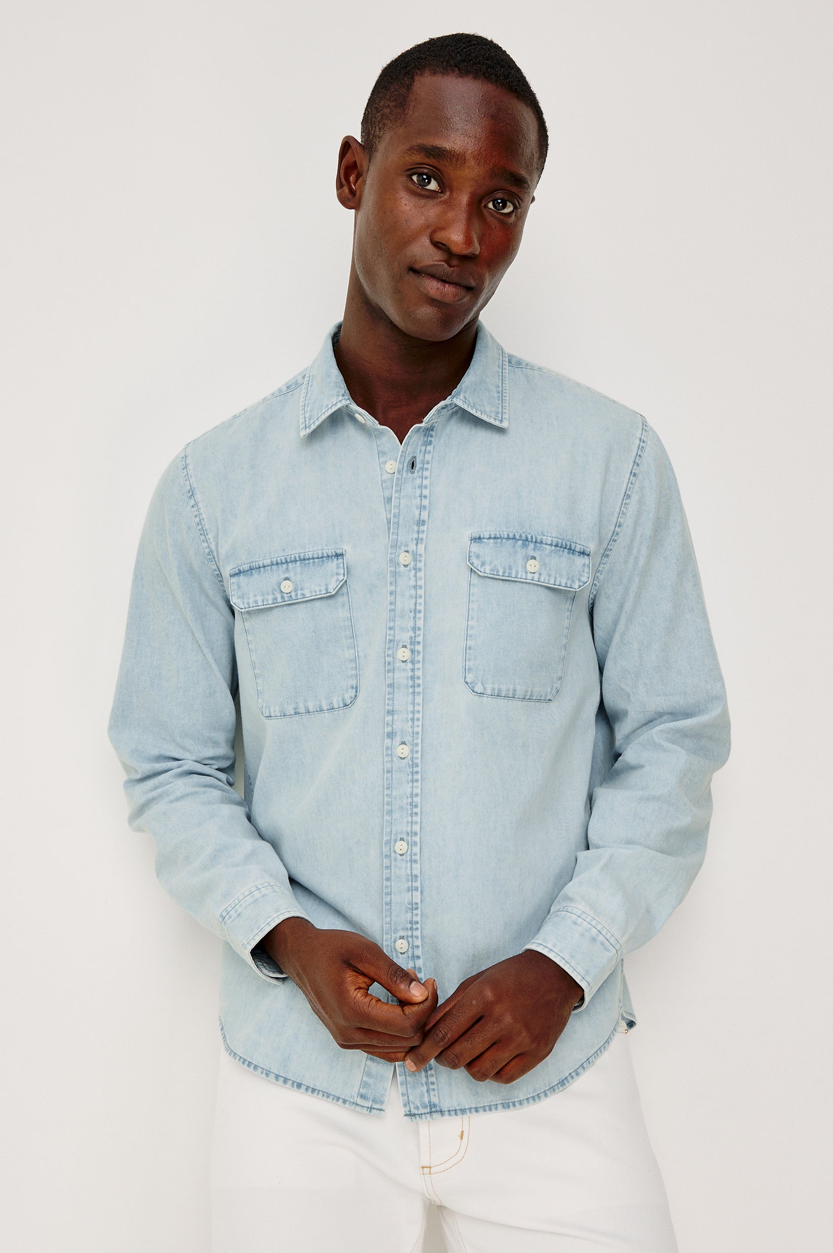 Meyer Shirt in Denim With Collar, Long Sleeves, and Chest Buttoned Flap Pockets in Light Vintage Wash - Upper Body Front View Featured on Model