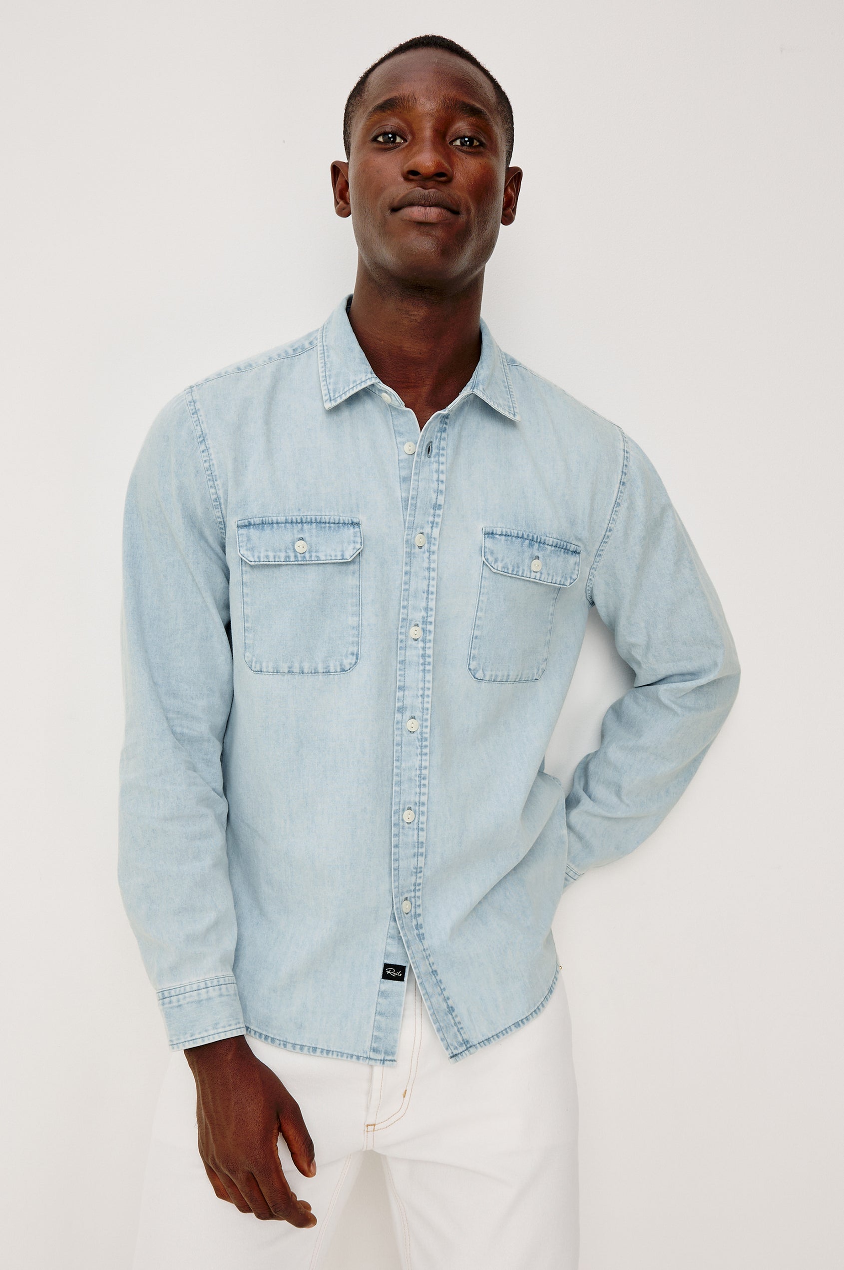 Meyer Shirt in Denim With Collar, Long Sleeves, and Chest Buttoned Flap Pockets in Light Vintage Wash - Upper Body Front View Featured on Model