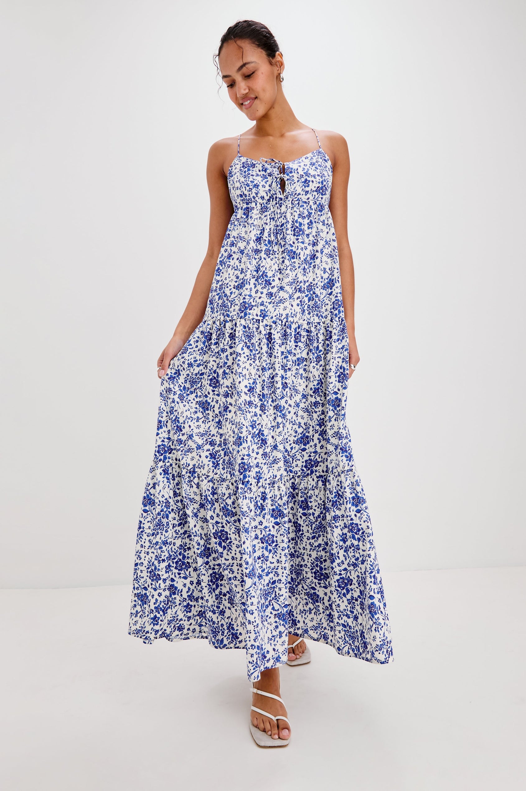 Mica Midi Tank Dress with Spaghetti Straps, a Keyhole at Center Front, Ties and a Tiered Skirt in Blue Marguerite Colorway. Front View Shown on Model.