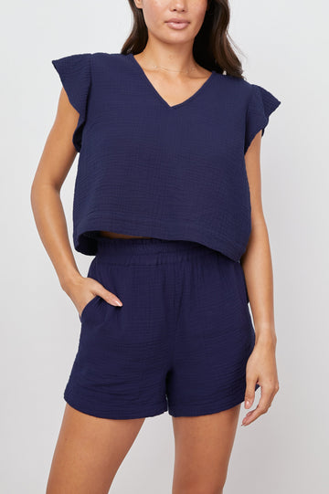 Miley Cropped, Short-Sleeve, V Neck Top with Flutter Sleeves and Textured Fabric in Admiral Blue Colorway - Front View Featured on Model