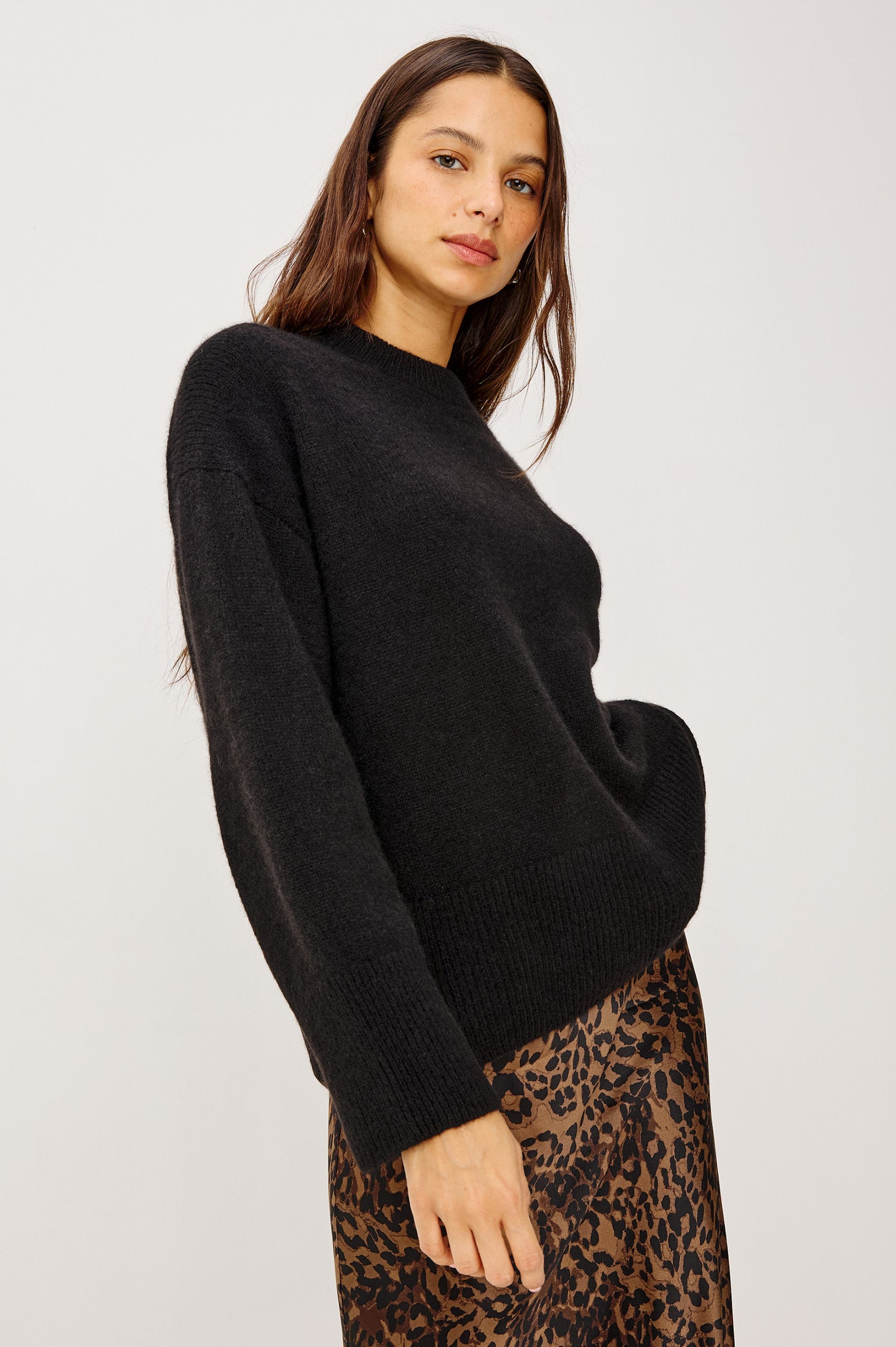 Miranda Long-Sleeve Sweater with a Mock Neck, Side Slits, and Ribbed Trim in Black Colorway - Front View Featured on Model