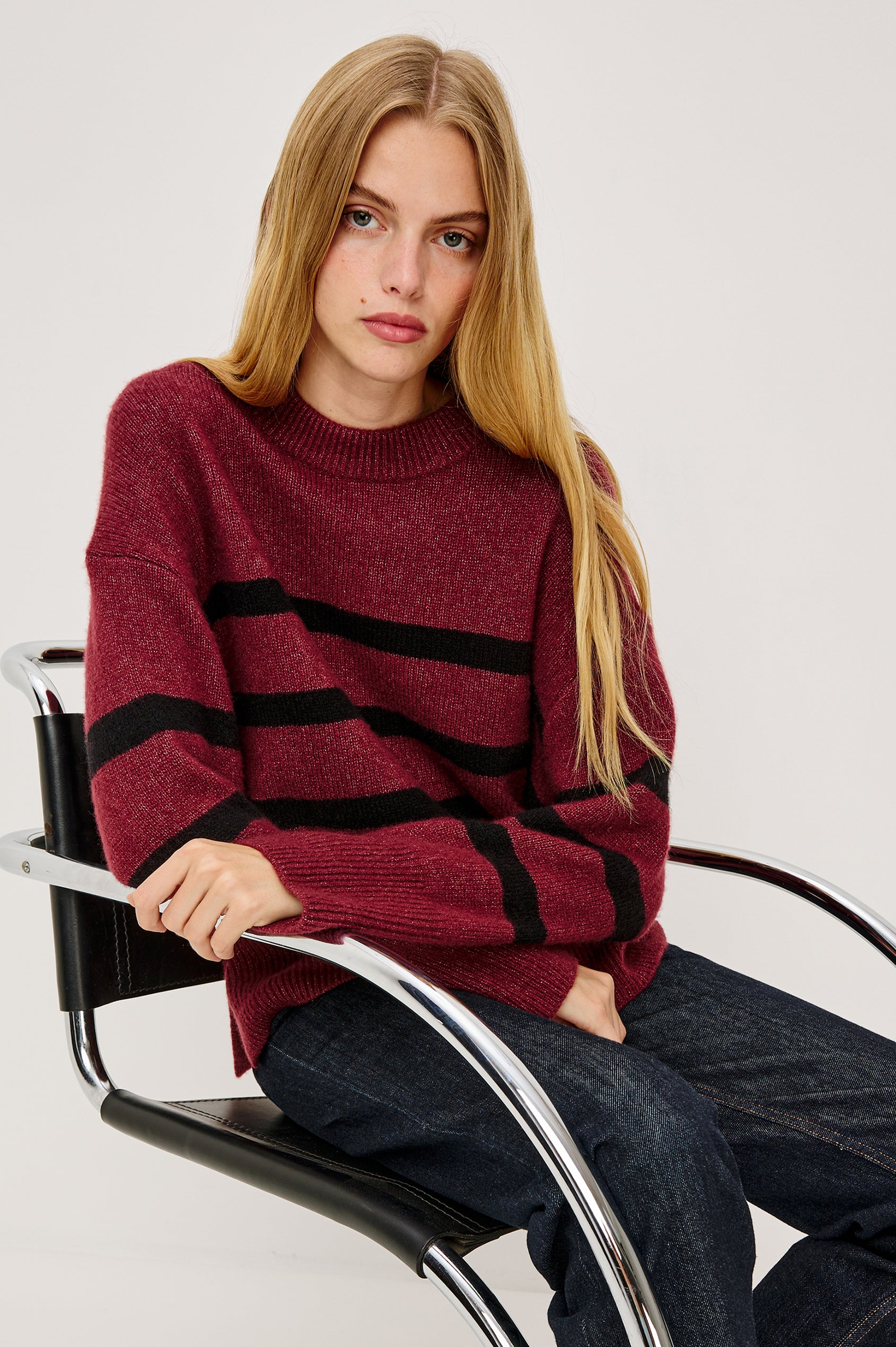 Miranda Long-Sleeve Sweater with a Mock Neck, Side Slits, and Ribbed Trim in Ivory Colorway - Stylized Front View Featured on Model