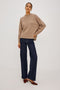 Miranda Sweater in Cashmere-Silk Blend With Relaxed Boxy Fit, Mock Neck, Drop Shoulders, and Side Slits at Hem in Oatmeal Colorway - Full Body Front View Featured on Model