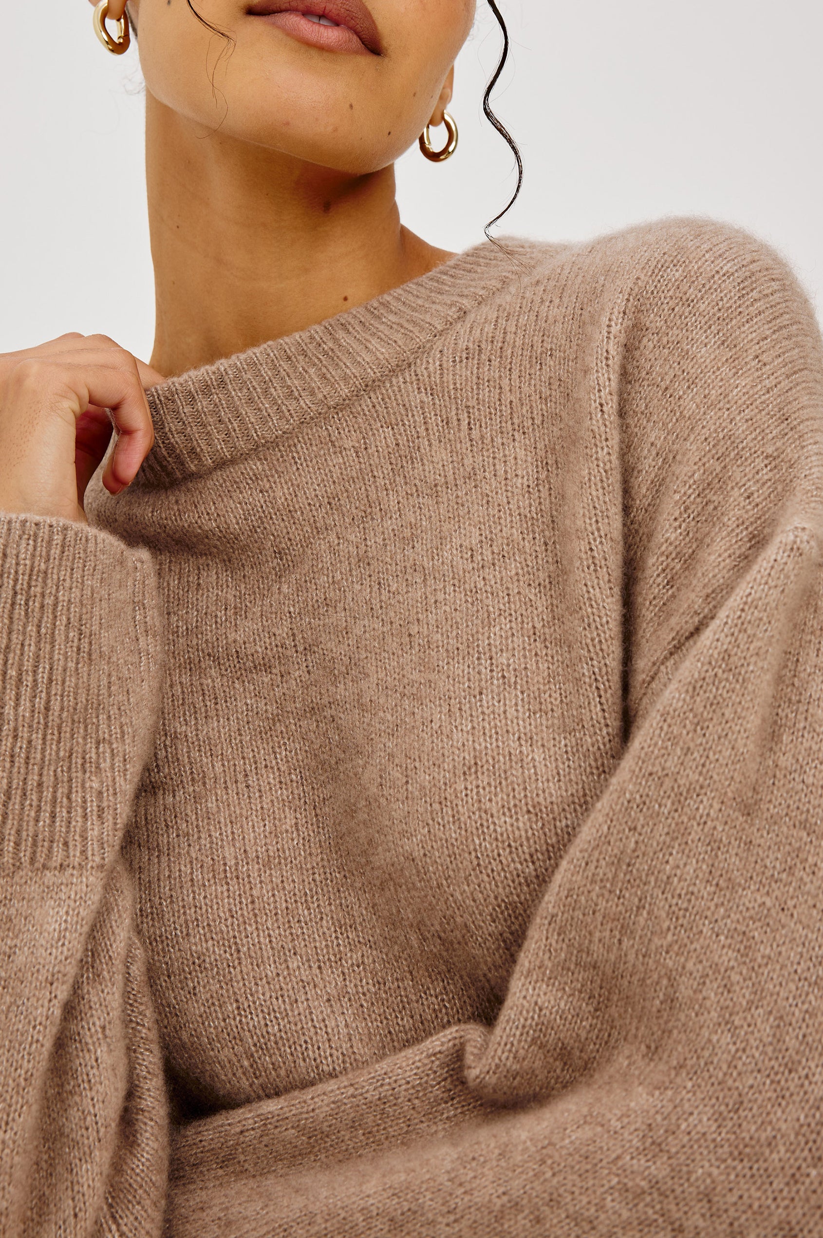 Miranda Sweater in Cashmere-Silk Blend With Relaxed Boxy Fit, Mock Neck, Drop Shoulders, and Side Slits at Hem in Oatmeal Colorway - Upper Body Close Up Front View Featured on Model