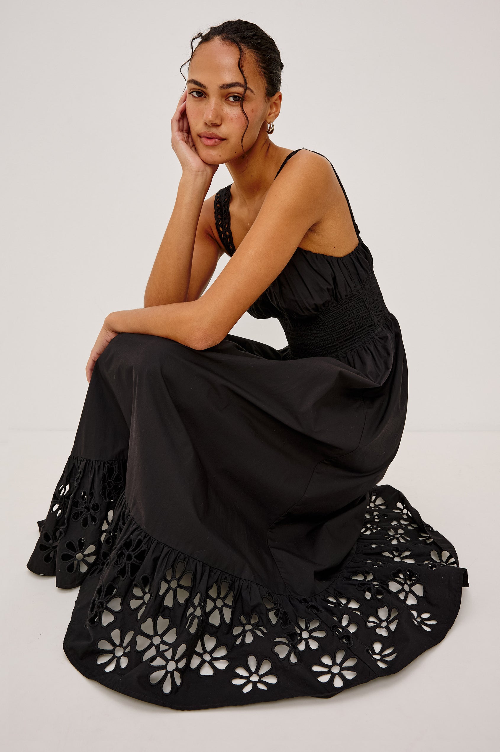 Moira Midi Dress in Cotton Poplin With Wide Embroidered Shoulder Straps, Soft Sweetheart Neckline, Smocked Empire Waist, Fully Lined Skirt With Floral Cutwork at Hem in Black Colorway - Full Body Front View Featured on Model