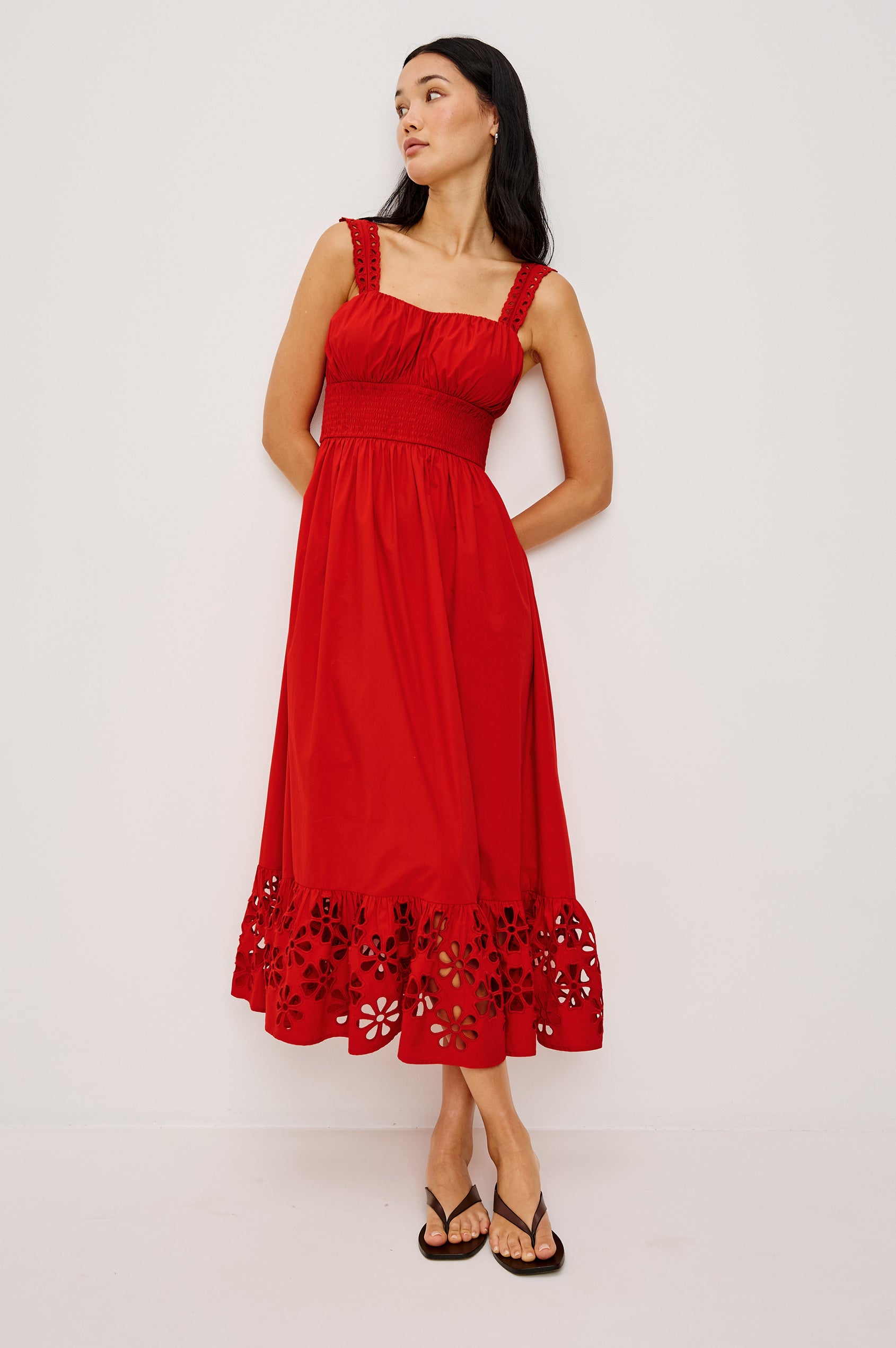 Moira Midi Dress in Cotton Poplin With Wide Embroidered Shoulder Straps Soft Sweetheart Neckline Smocked Empire Waist Fully Lined Skirt With Floral Cutwork at Hem in Scarlet Colorway - Full Body Front View Featured on Model