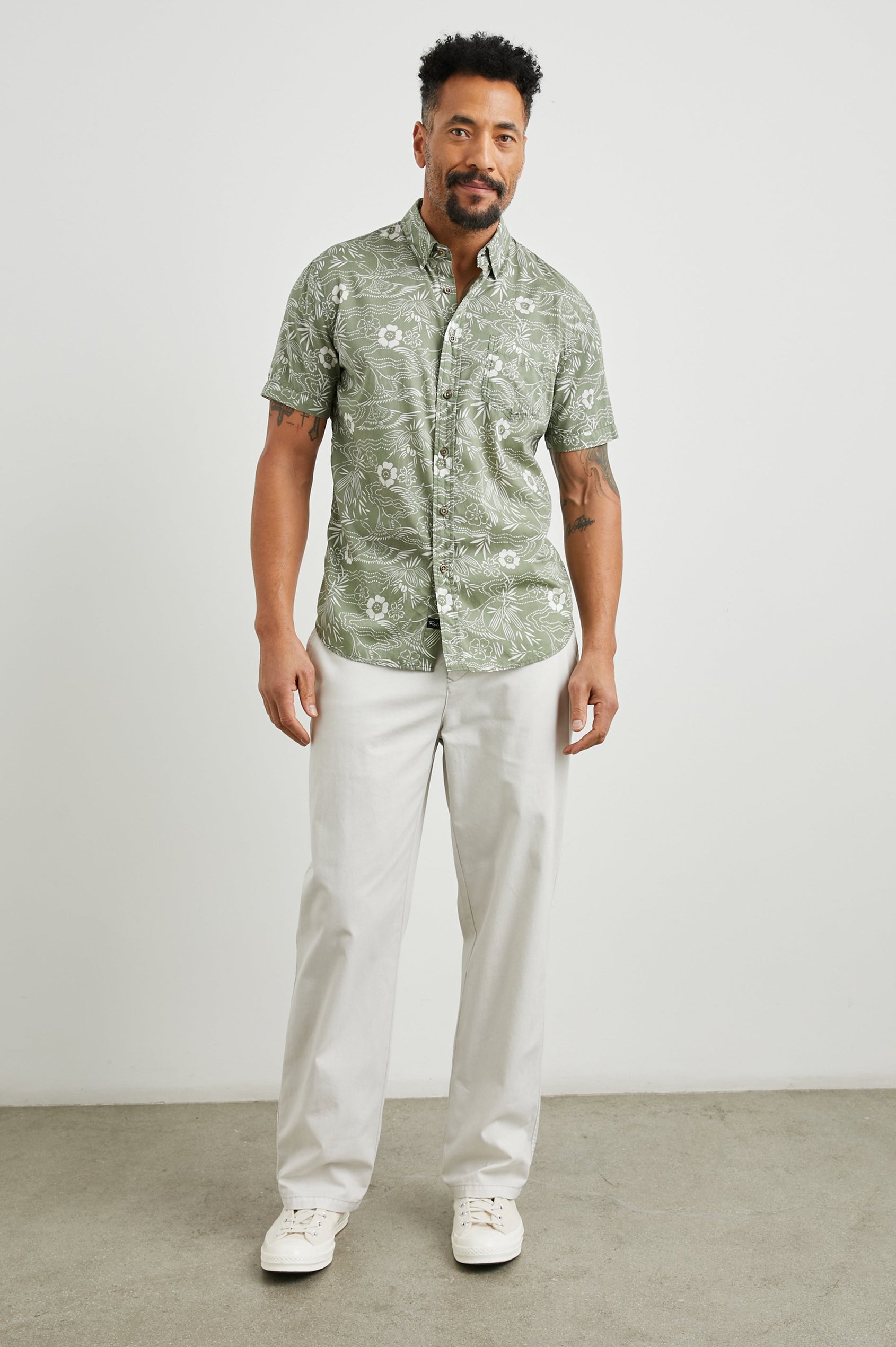Monaco Short-Sleeve Button Up with a Chest Patch Pocket in Japanese Stencil Fatigue Colorway, a White Floral Print on Fatigue - Front Full Body View Featured on Model