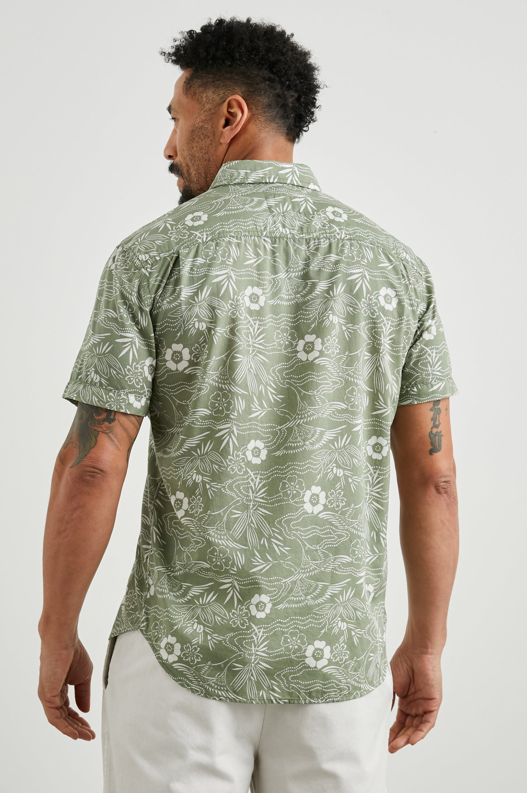 Monaco Short-Sleeve Button Up with a Chest Patch Pocket in Japanese Stencil Fatigue Colorway, a White Floral Print on Fatigue - Back View Featured on Model