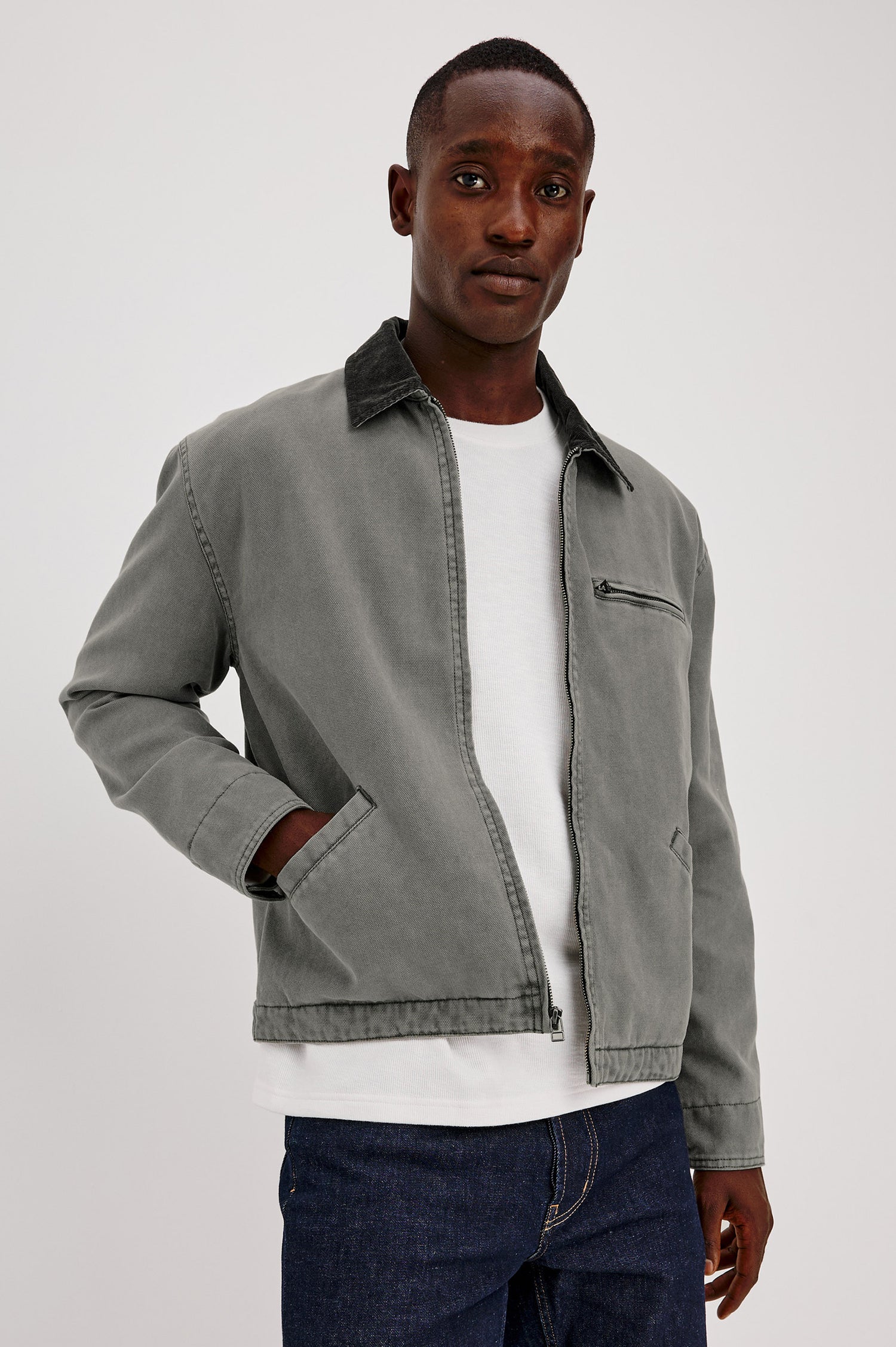 Morro Workwear Utility Jacket in Heavy Cotton Canvas Duck With Corduroy Collar, Chest Zip Pocket, Side Welt Pockets, and Custom Dobby Lining in Graphite Colorway - Upper Body Front View Featured on Model