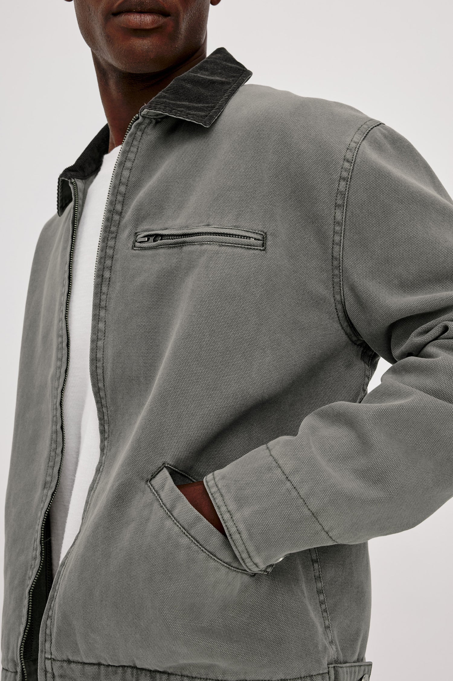 Morro Workwear Utility Jacket in Heavy Cotton Canvas Duck With Corduroy Collar, Chest Zip Pocket, Side Welt Pockets, and Custom Dobby Lining in Graphite Colorway - Upper Body Close Up View Featured on Model