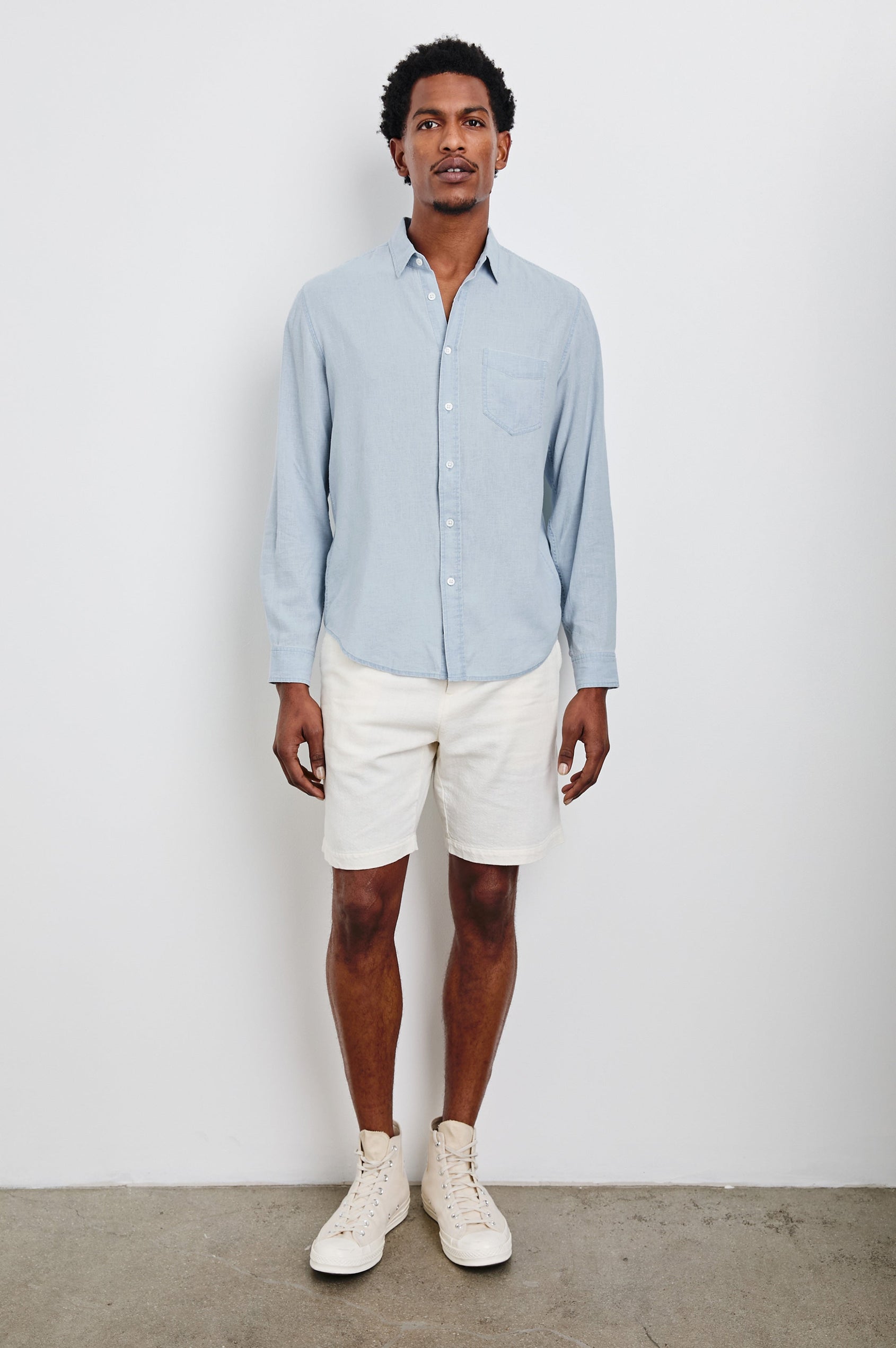 Mykonos linen button up long sleeve with front chest pocket and collar in Blue Lagoon - full body front view on model