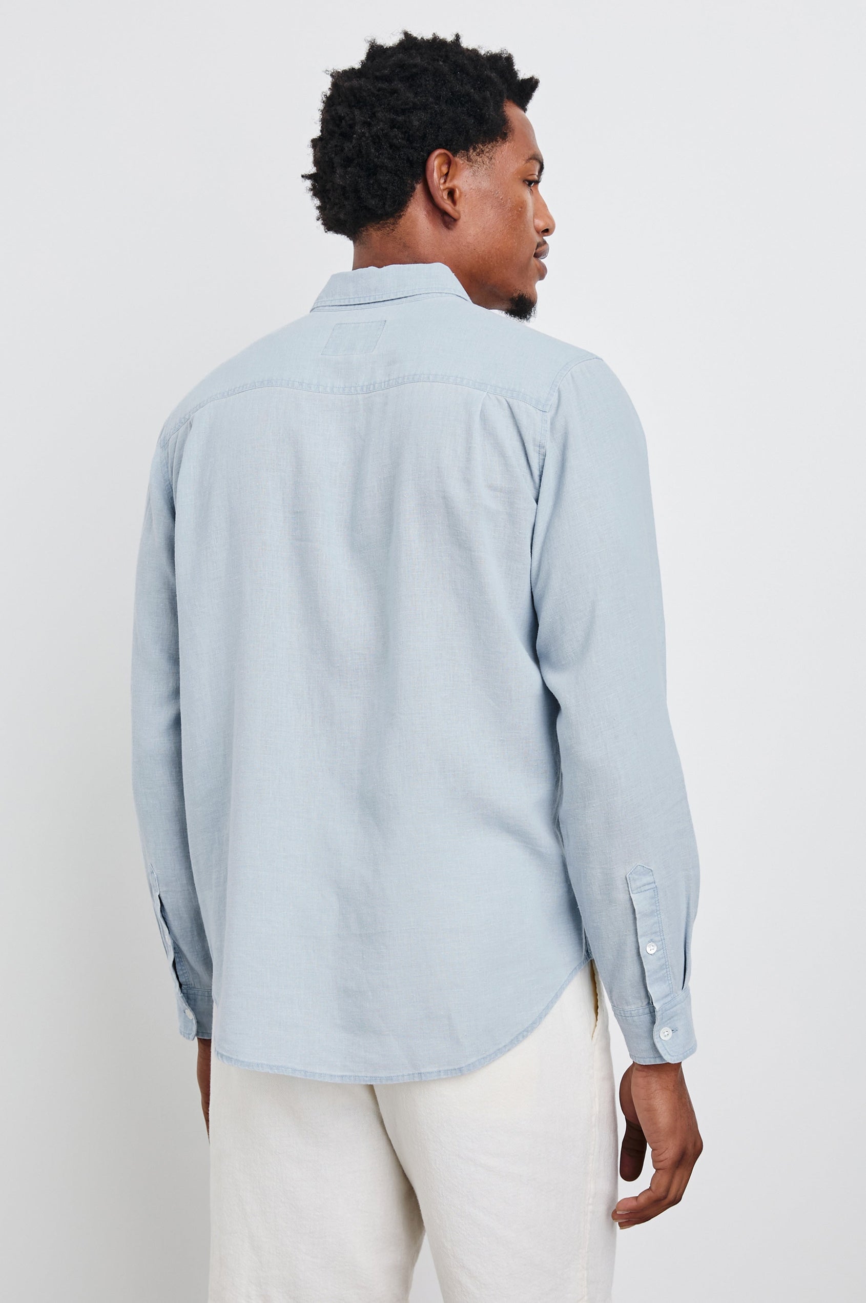 Mykonos linen button up long sleeve with front chest pocket and collar in Blue Lagoon - back view on model