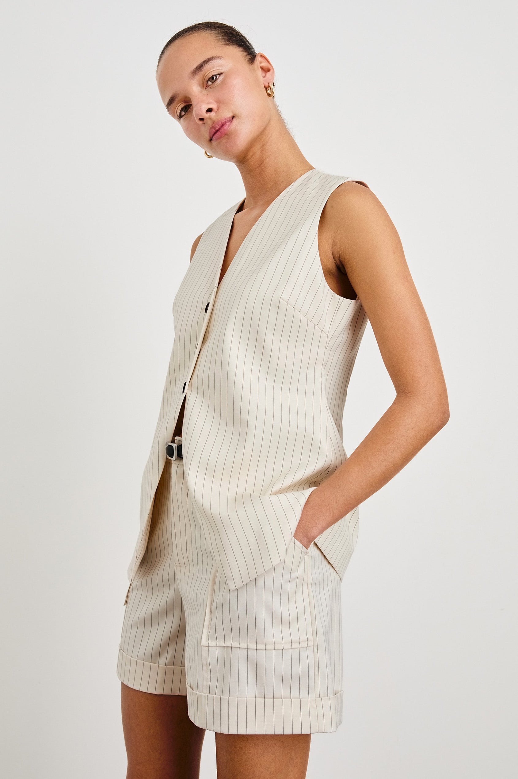 Mylah longline tan vest with black buttons in Birch Pinstripe - on model, front at slight angle
