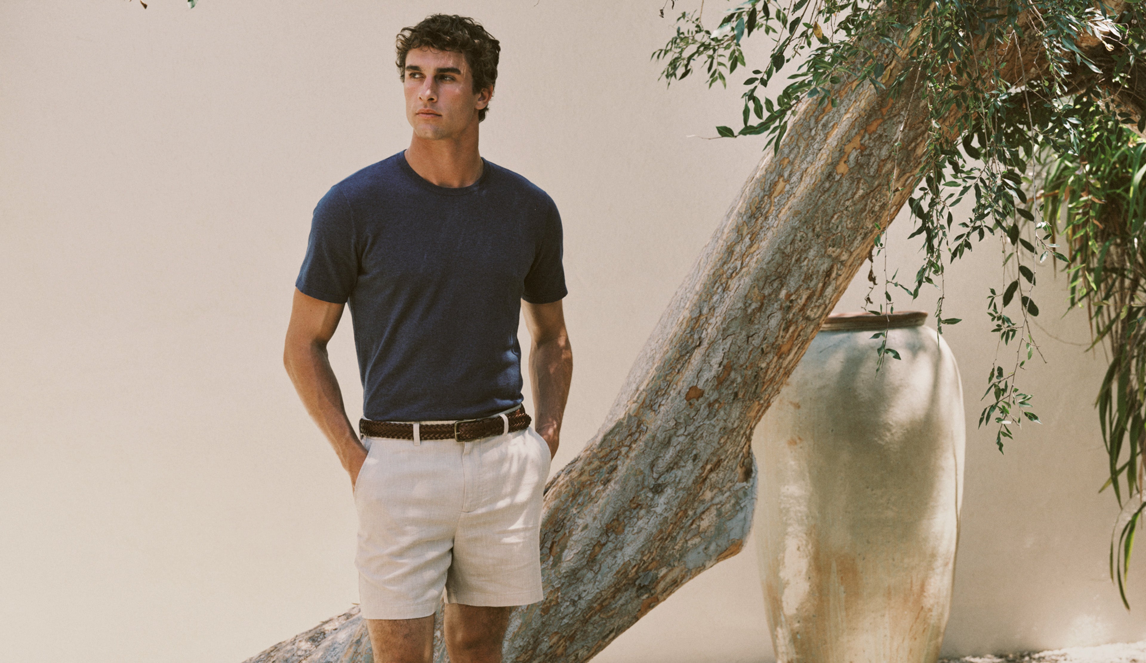 Man wearing a blue t-shirt and white shorts