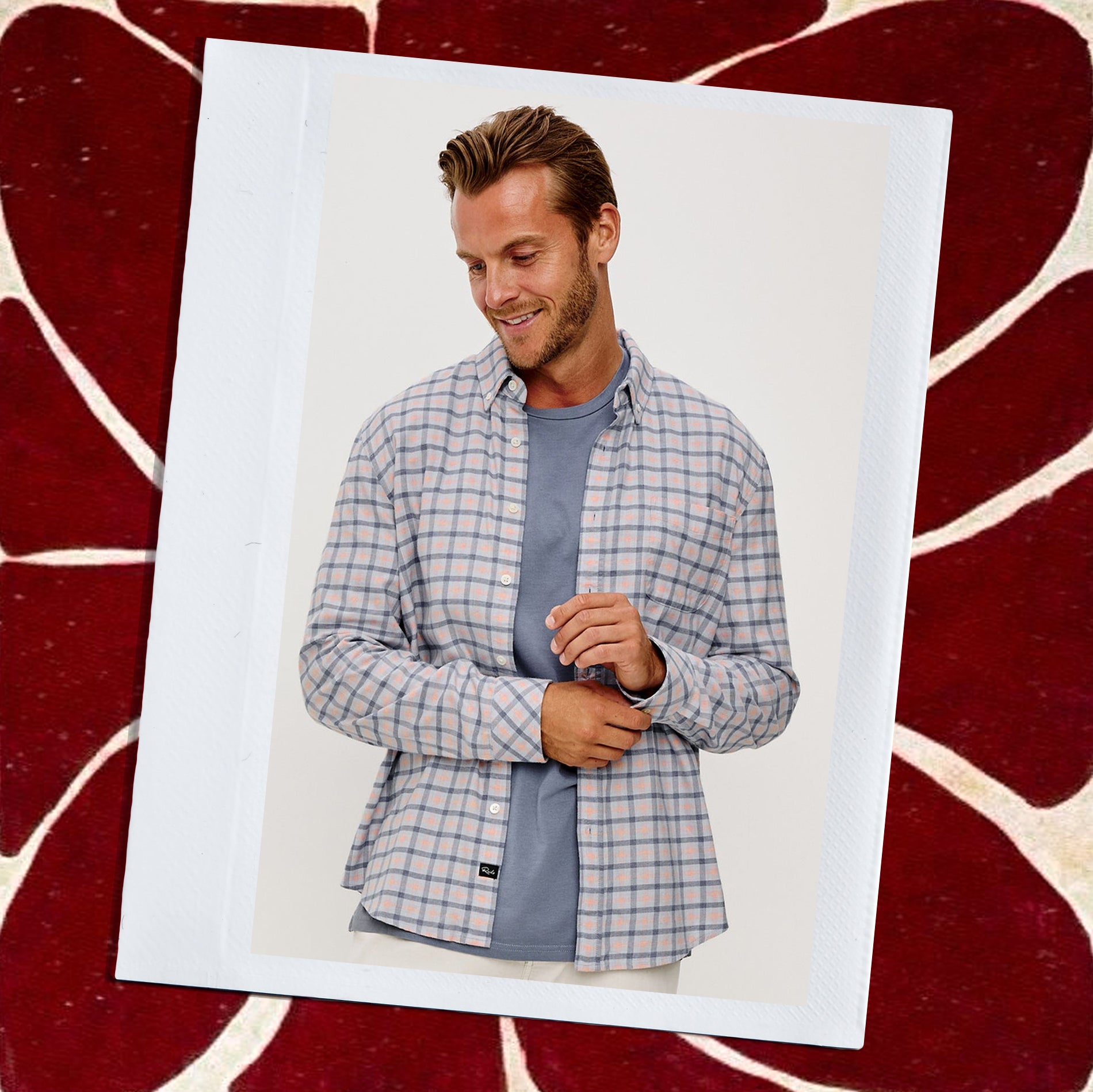 Man wearing a plaid shirt over a blue t-shirt on a white background