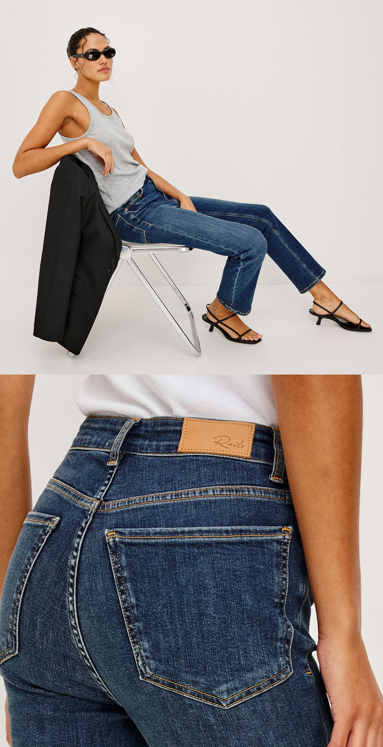 Close-up of a woman wearing blue jeans sitting on a chair.
