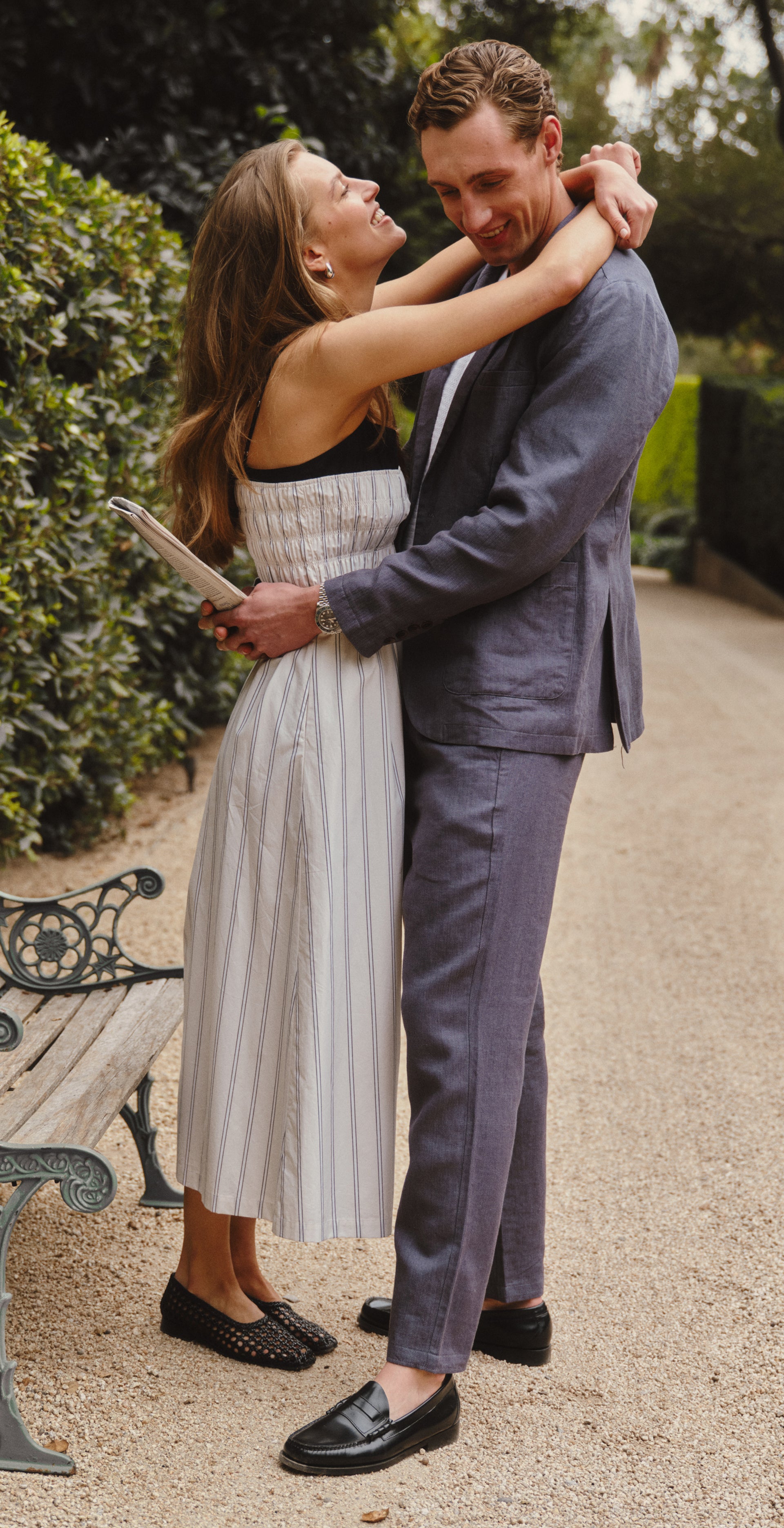Couple hugging on a trail path